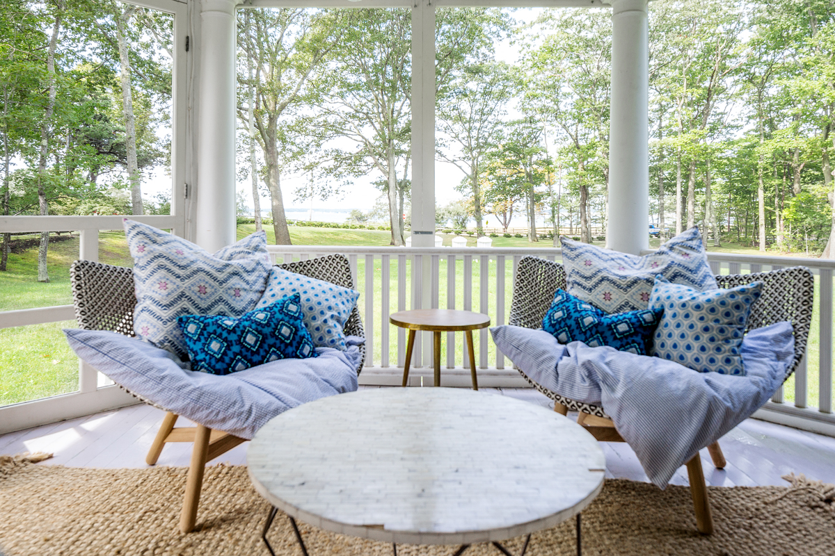 On the screened porch, Dedon lounge chairs are constructed of durable all-weather materials. Pratt says, “The pieces are contemporary, but not so much that it’s out of place here.”