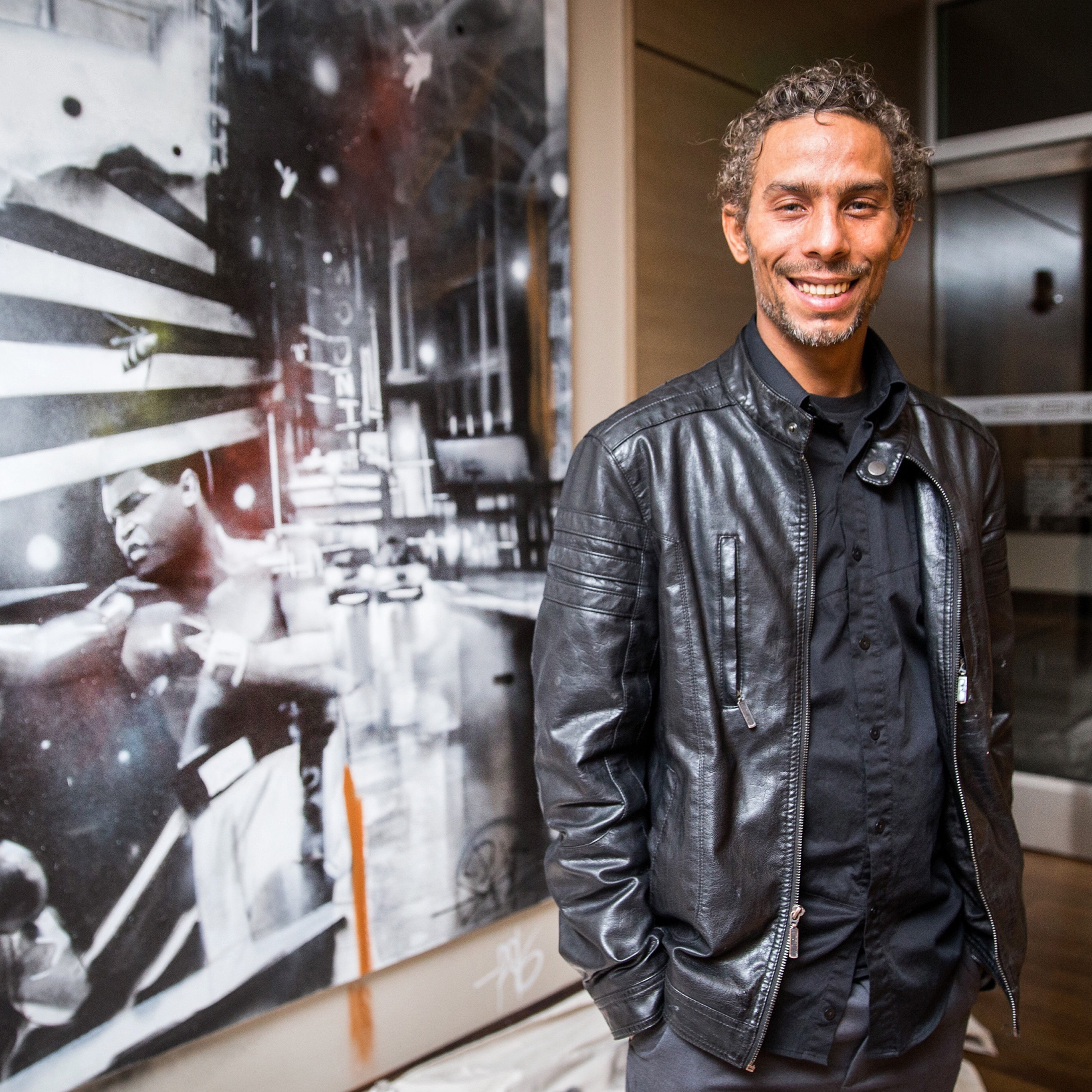 Percy Fortini-Wright with the mural.