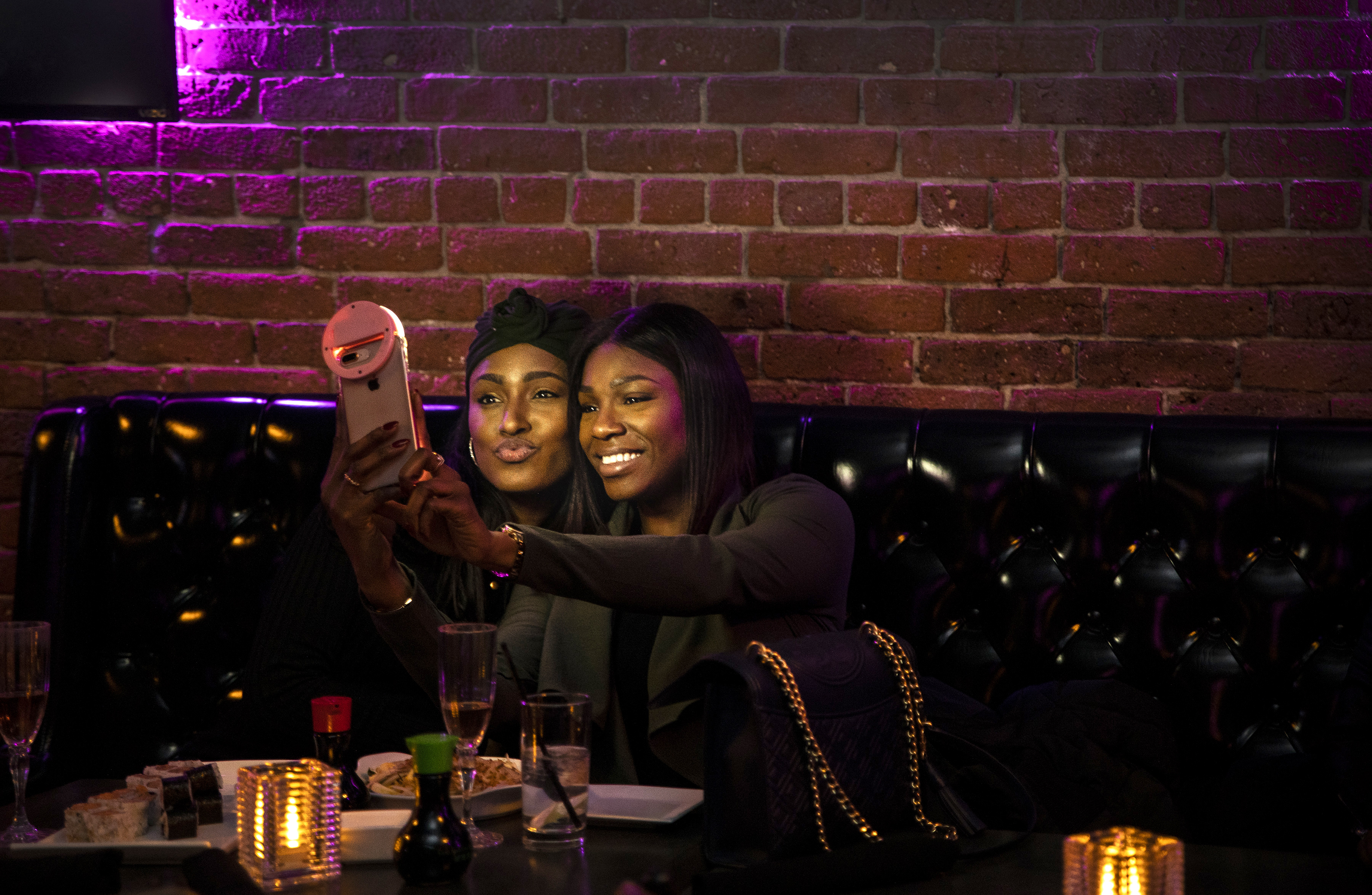 Natalee Pennicooke (left) and Melanie Amarante snapped a selfie at the Toast to Black Excellence event at 2Twenty2 Lounge held by Farrah Belizaire and her company LiteWork.