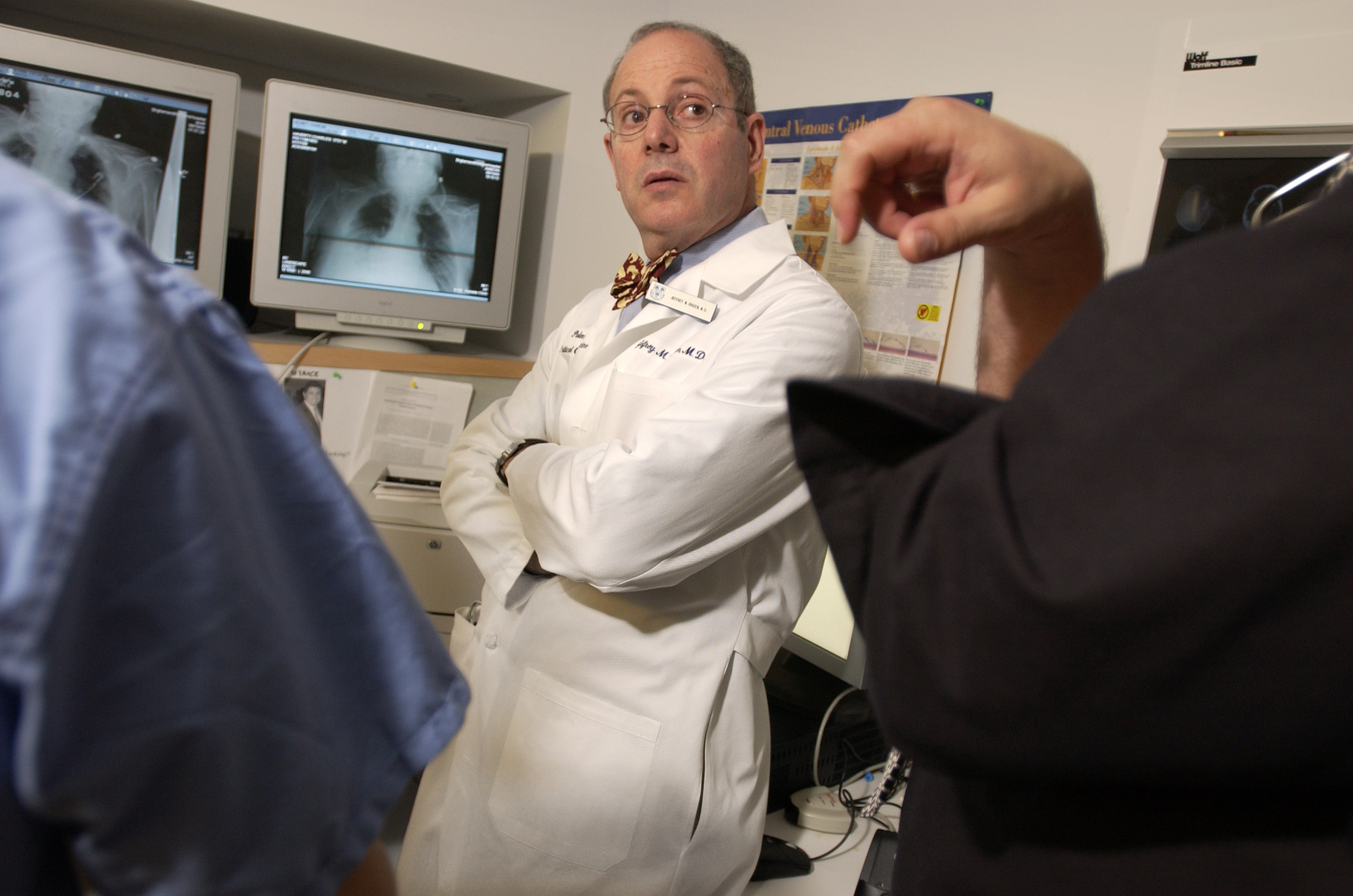 Dr. Jeffrey Drazen (center) is the editor-in-chief of the New England Journal of Medicine.