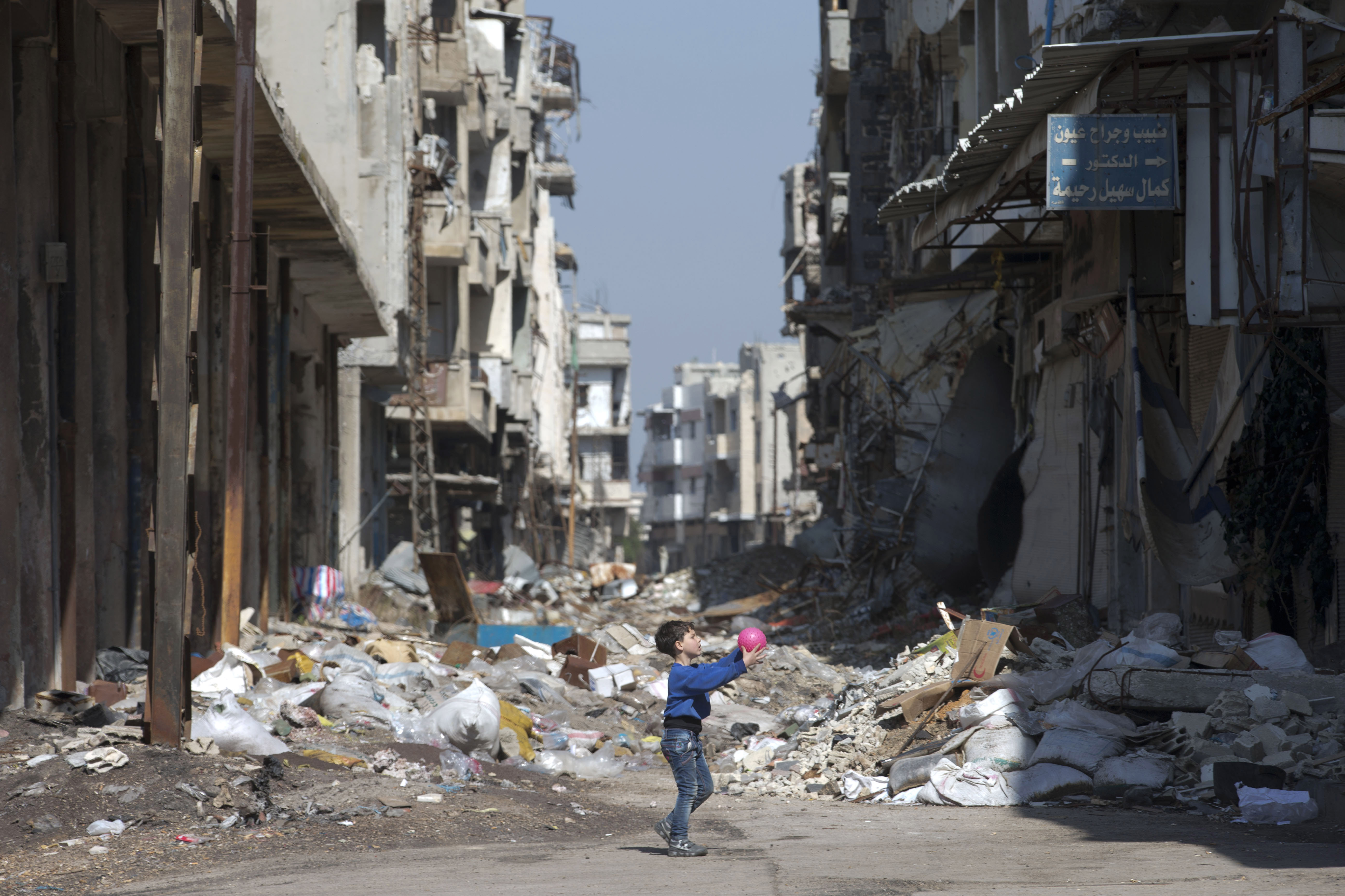 A Syrian boy played between destroyed buildings in the old city of Homs, Syria, on Friday.
