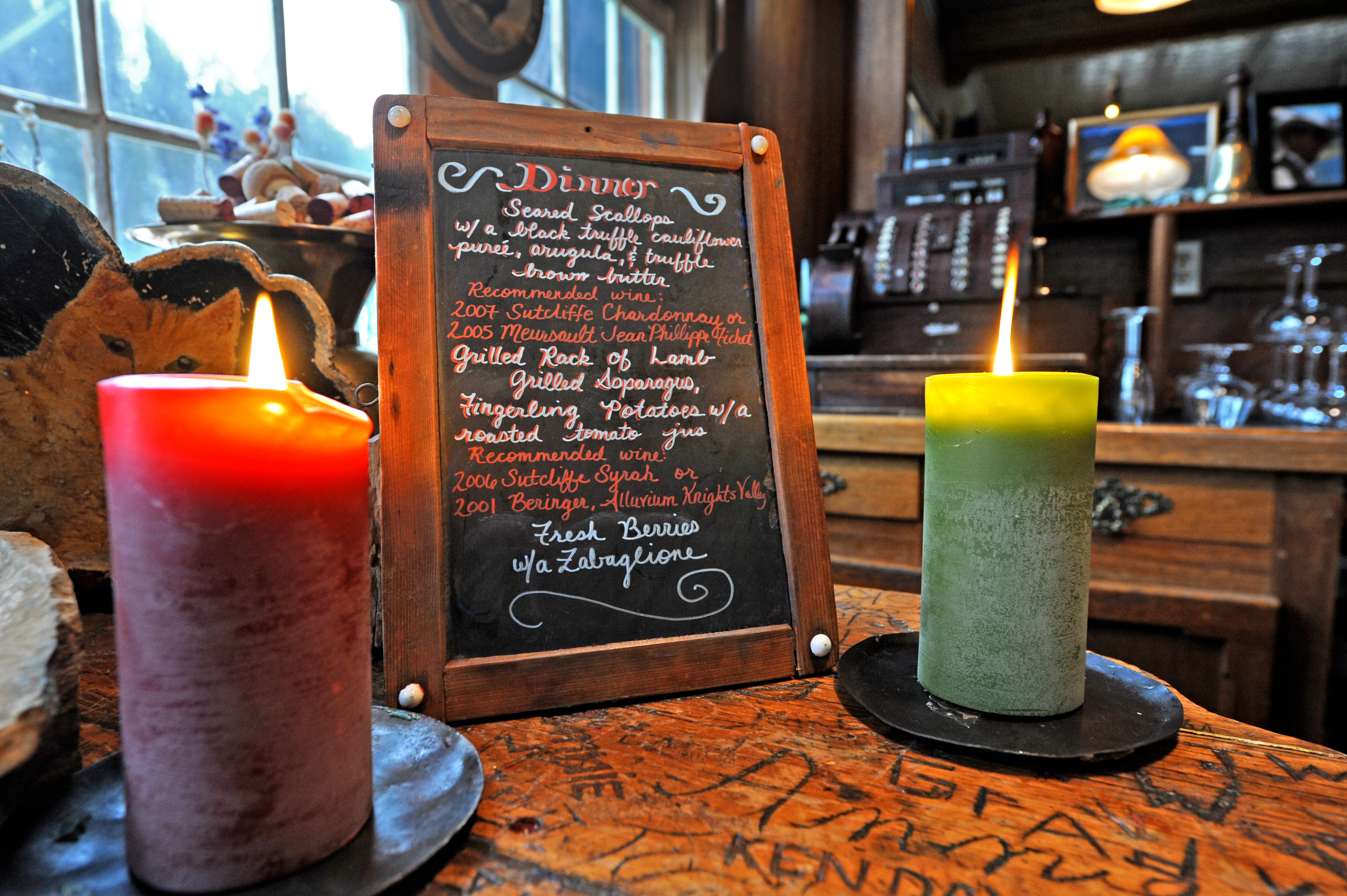 The evening's dinner menu is displayed on top of the bar. Guests enjoy local and organic food prepared by chef James Weiler.