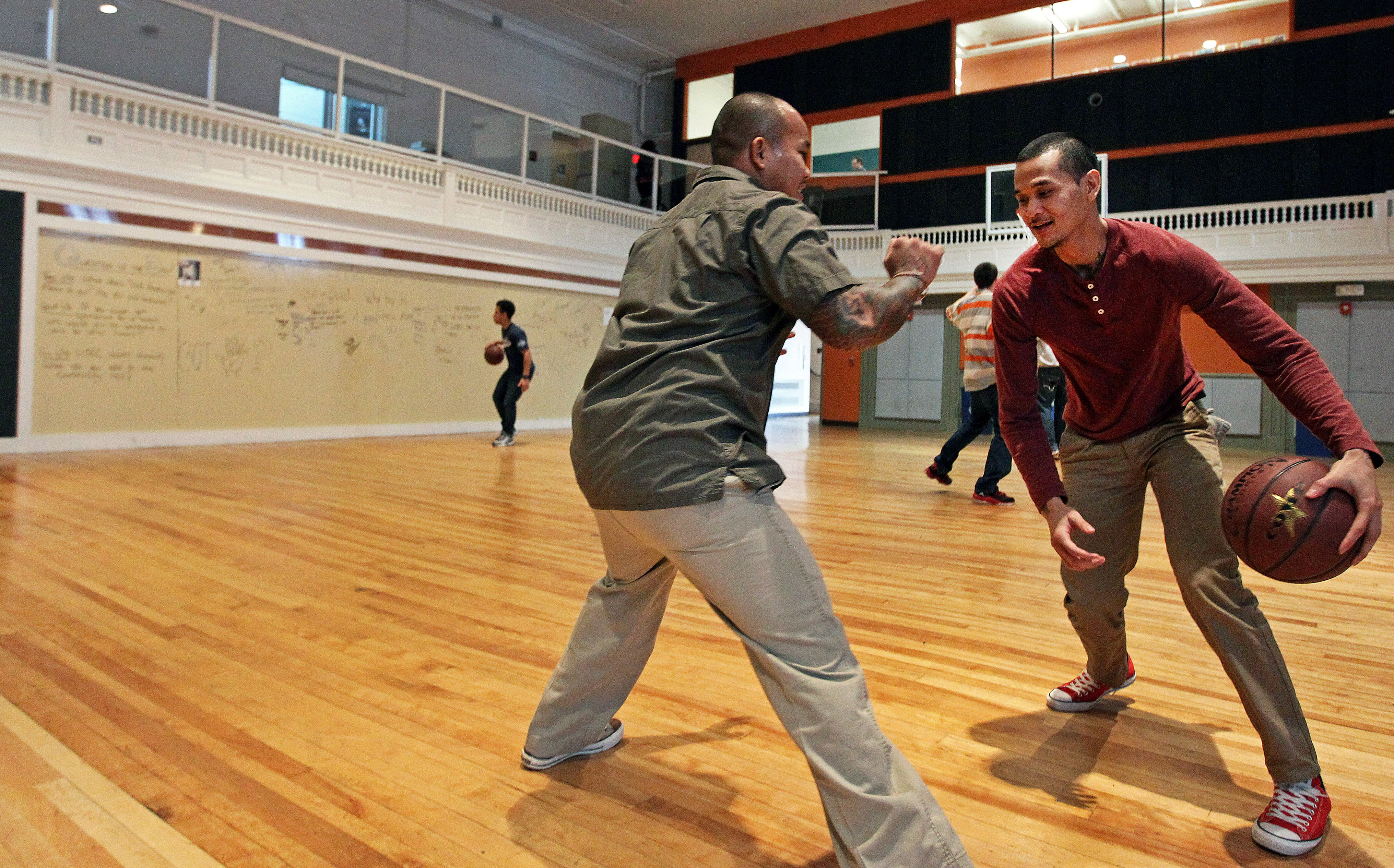 United Teen Equality Center employees Sakieth “Sako” Long, left, and Siborak “Eric” Ponn take a break.