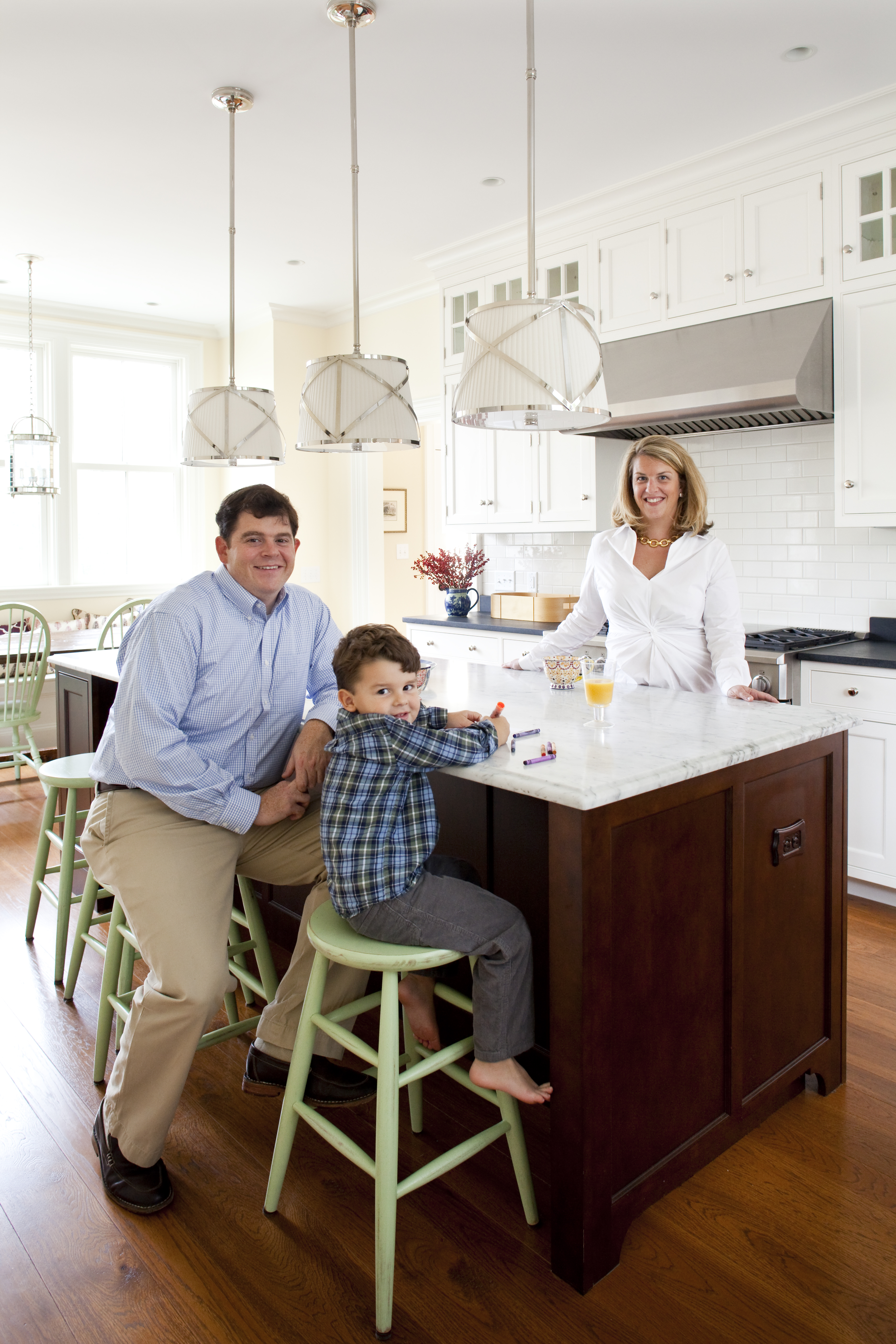 Ben and Angela Cavallo, pictured with their son, Sam, both had a say in the design of the powder room at their Dedham home. But Angela left the decisions about the layout, materials, and appliances in the kitchen to Ben, who loves to cook.