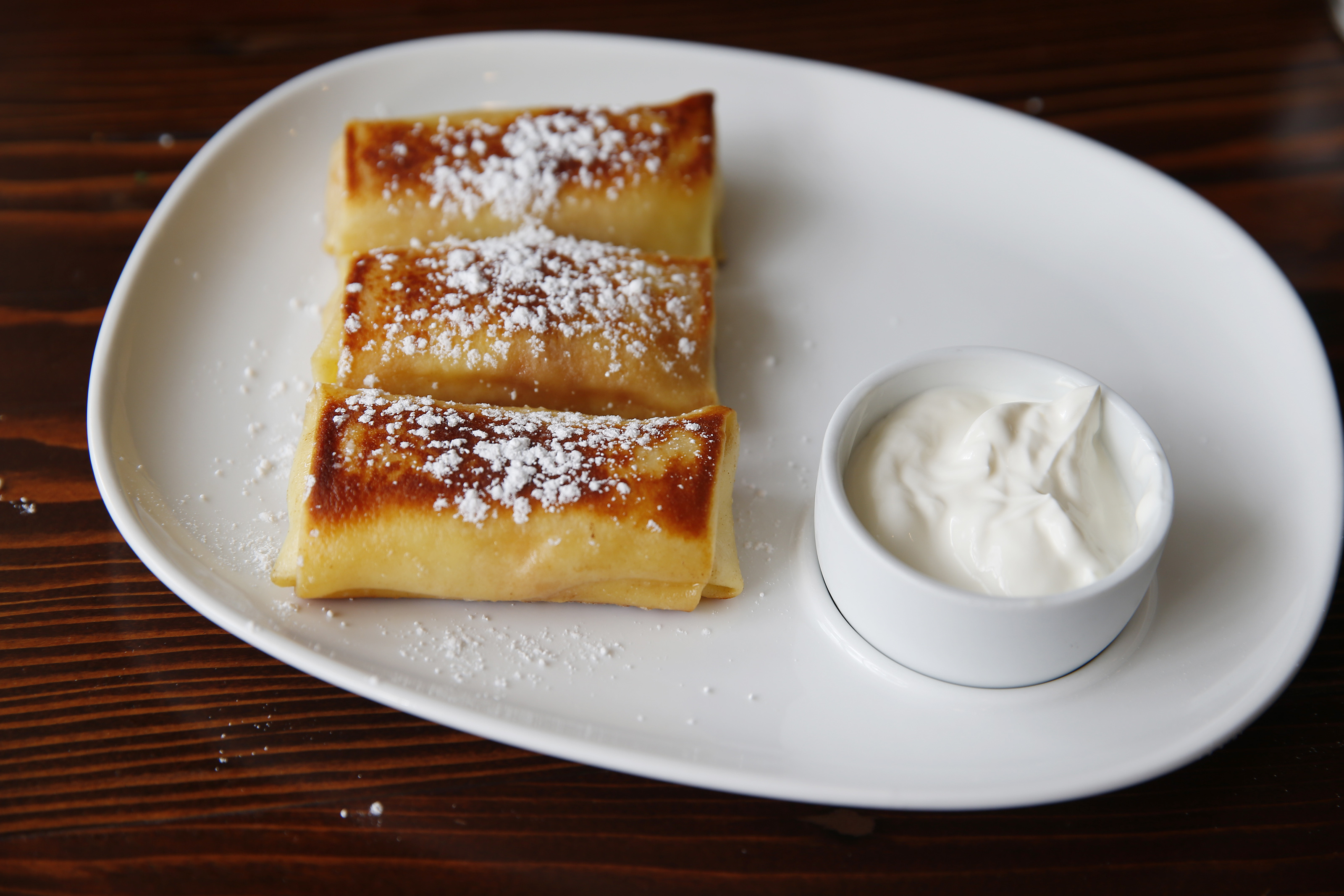 Crepes with sweet cheese and raisins.