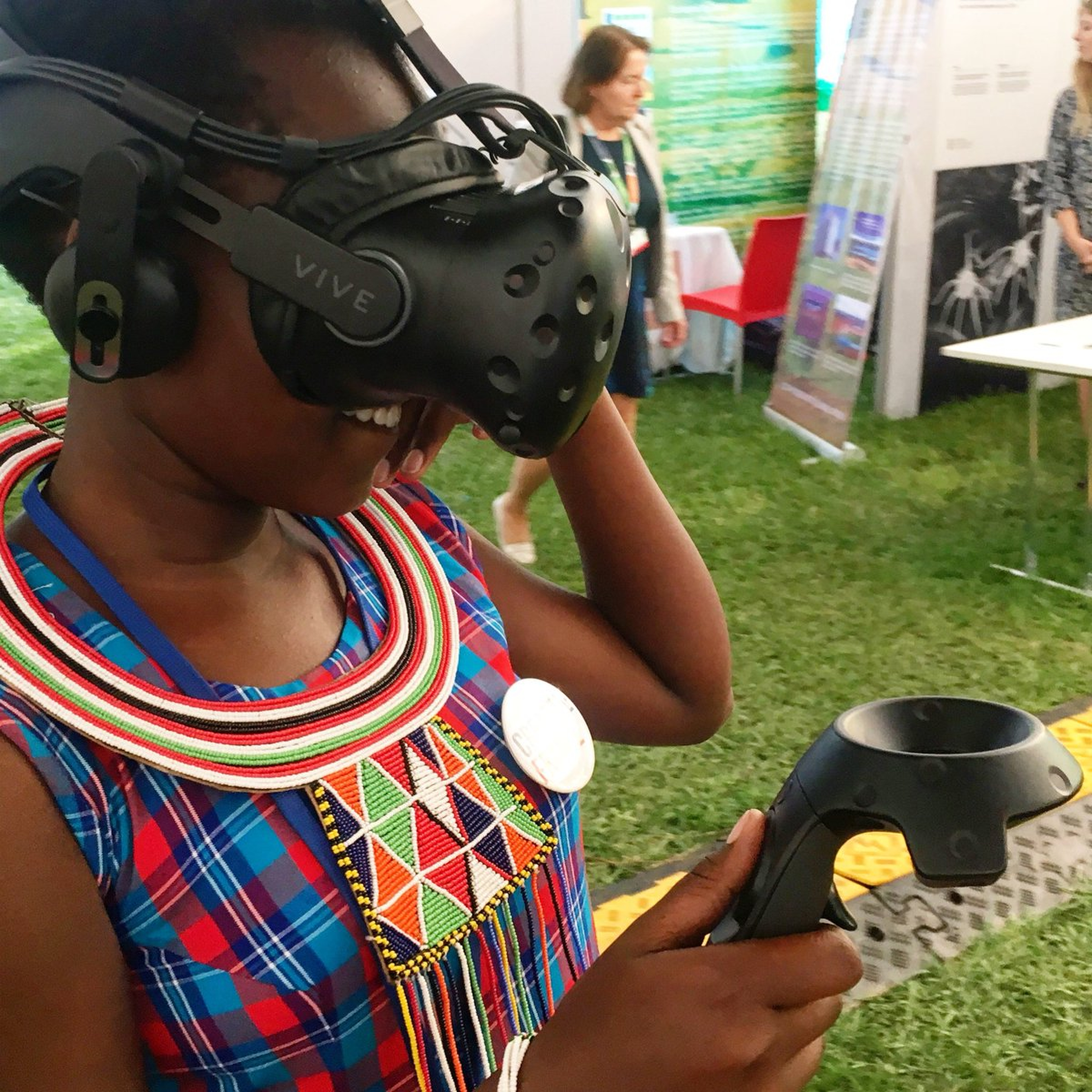 A Kenyan woman trying virtual reality for the first time at United Nations Environment Assembly.