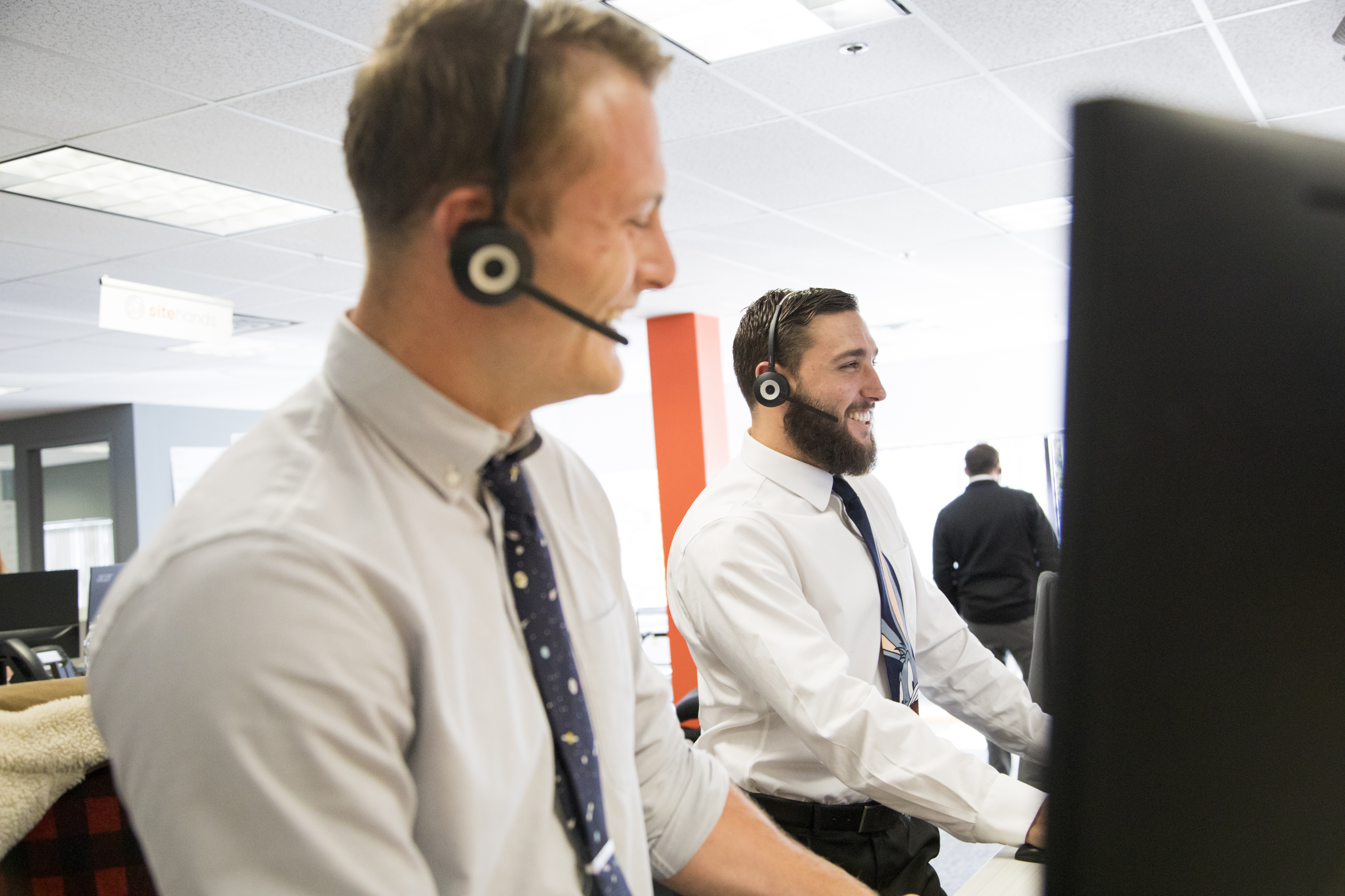 Formal Thursdays at Reveneer have a throwback vibe, as casual dress gives way to shirts and ties like those worn by Alec Matys (right) and John Klug.