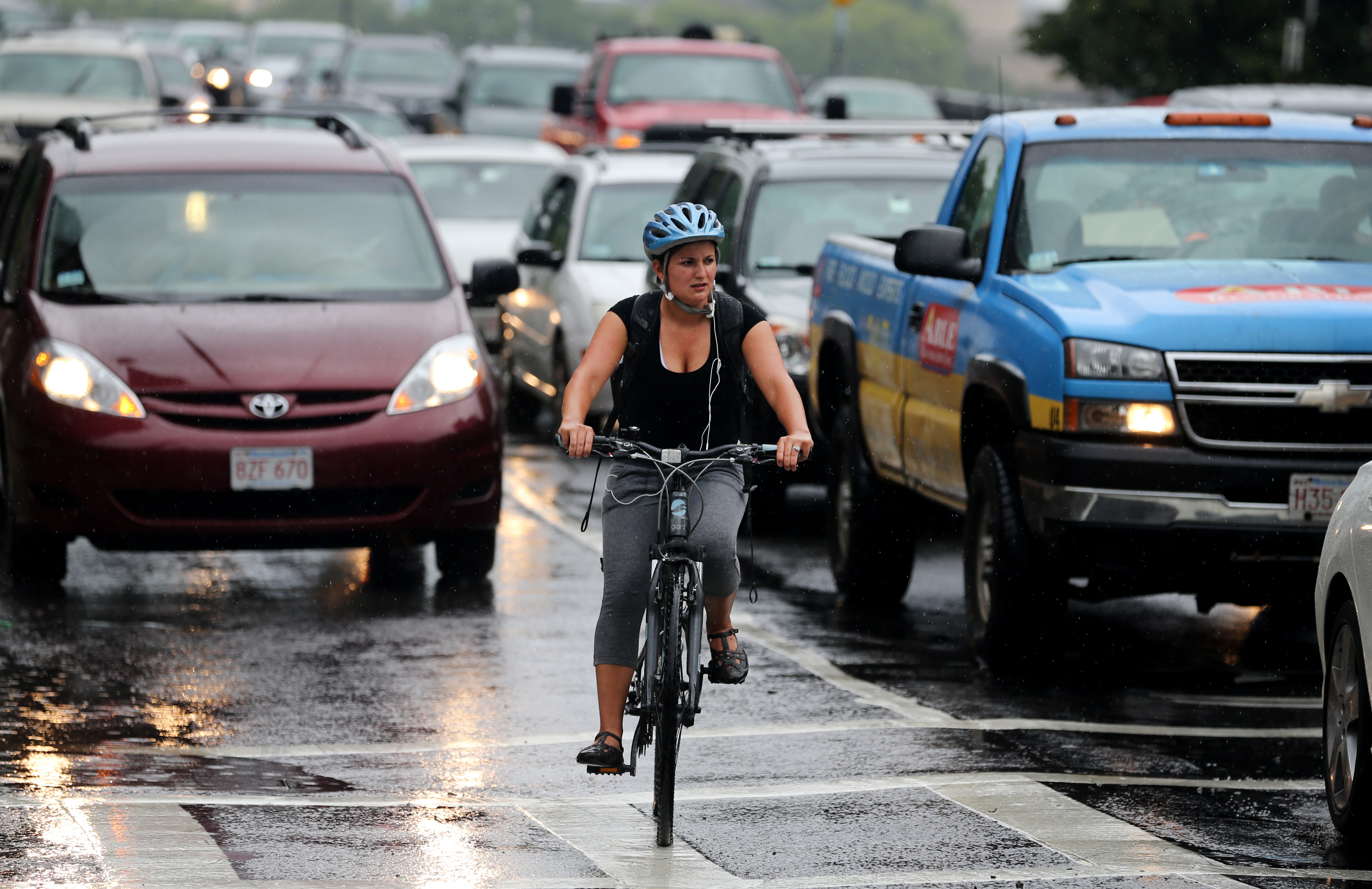A cyclist navigates the intersection of Massachusetts Ave and Beacon St.
