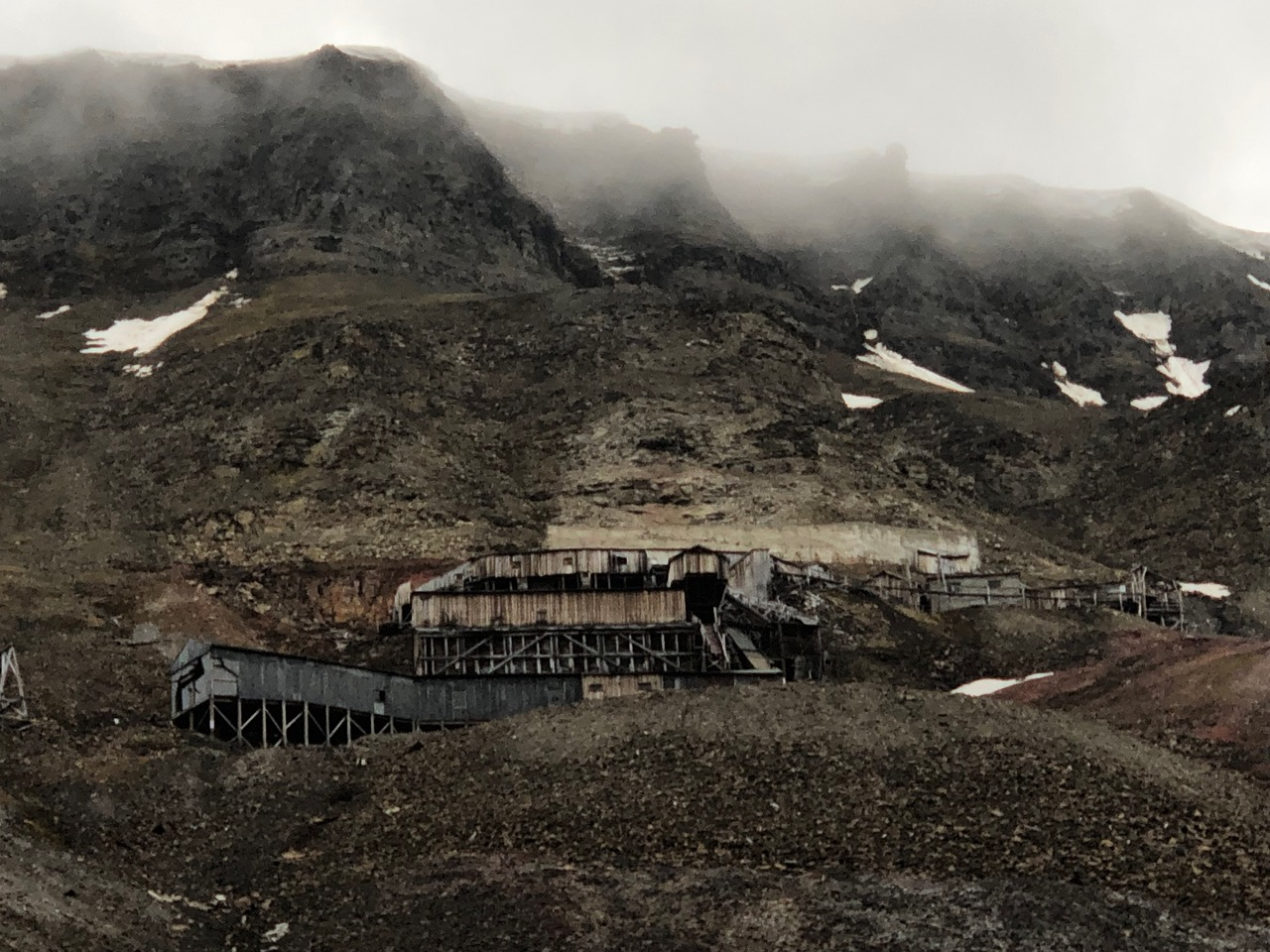 An abandoned coal mine on a slope above Longyearbyen.