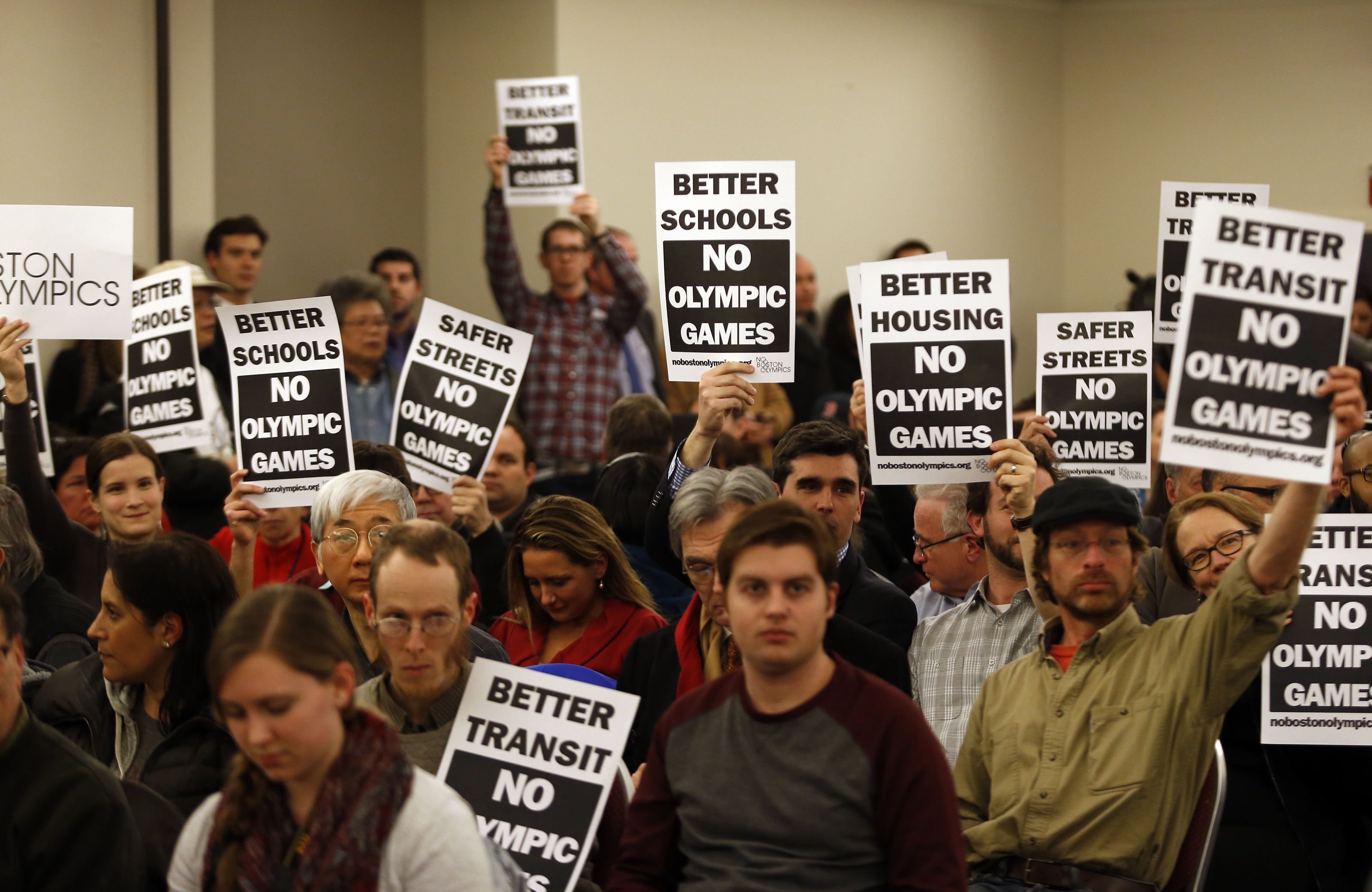 At a community meeting last February on Boston’s Olympic and Paralympic bid, activists make it clear which side of the contentious issue they are on.