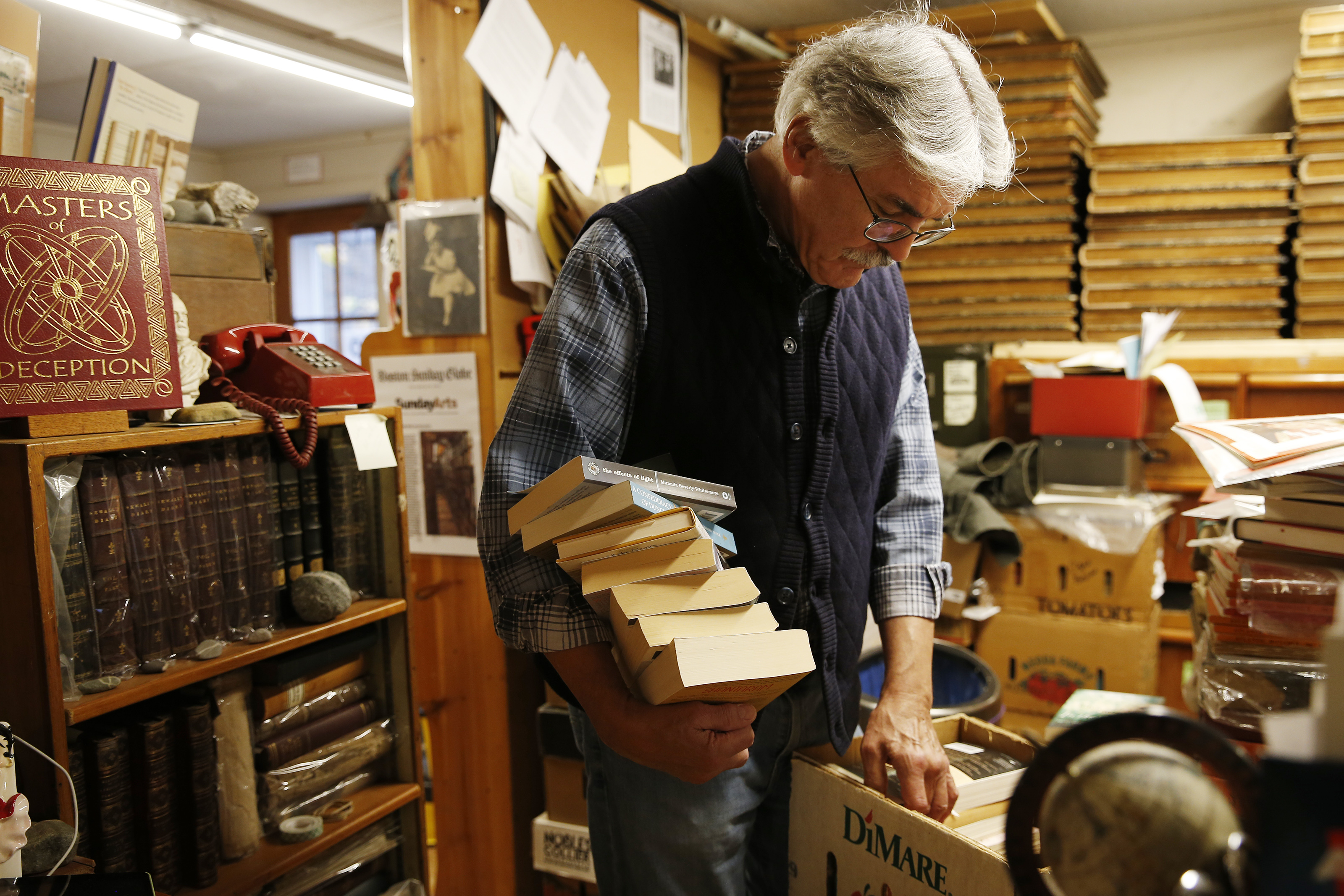 Vince McCaffrey sorted through online orders at Avenue Victor Hugo in Lee, N.H. It was formerly housed in Boston.