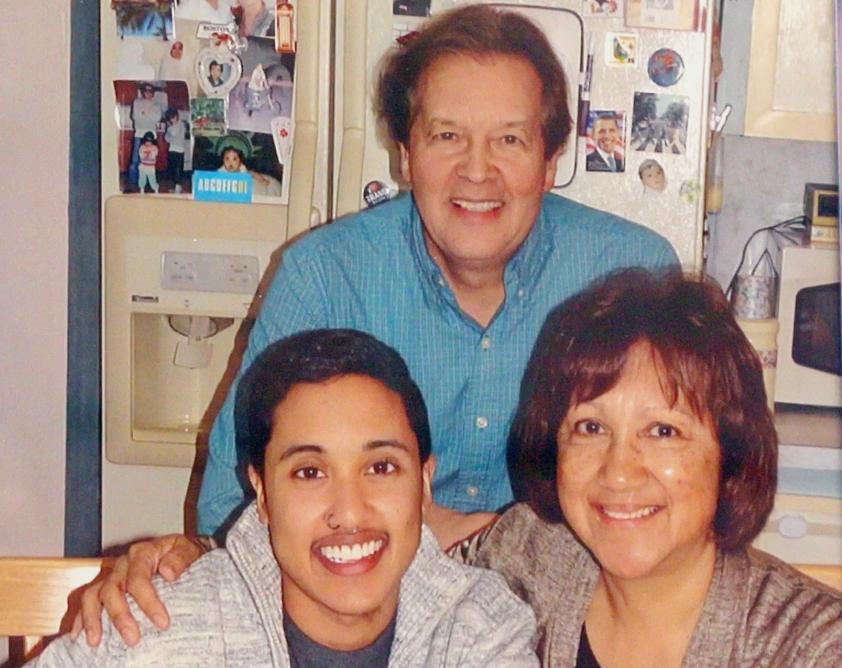 Vernon (center) and Beryl Domingo (right) with their transgender son, Micah.