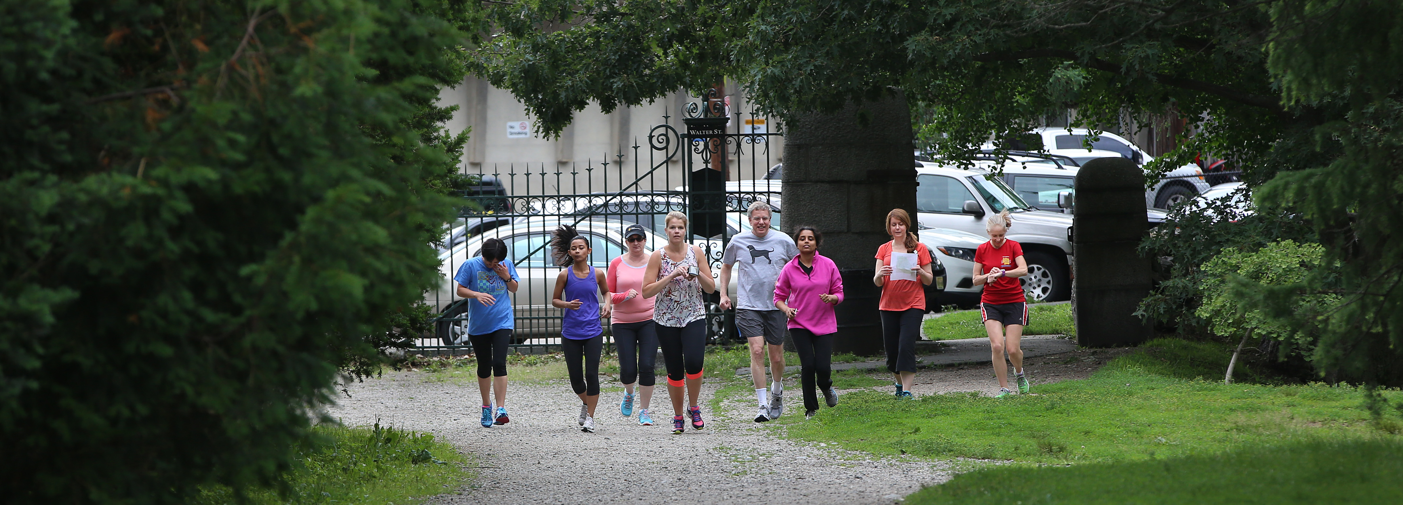 Downs and Walsh are joined by other runners in the Arboretum.