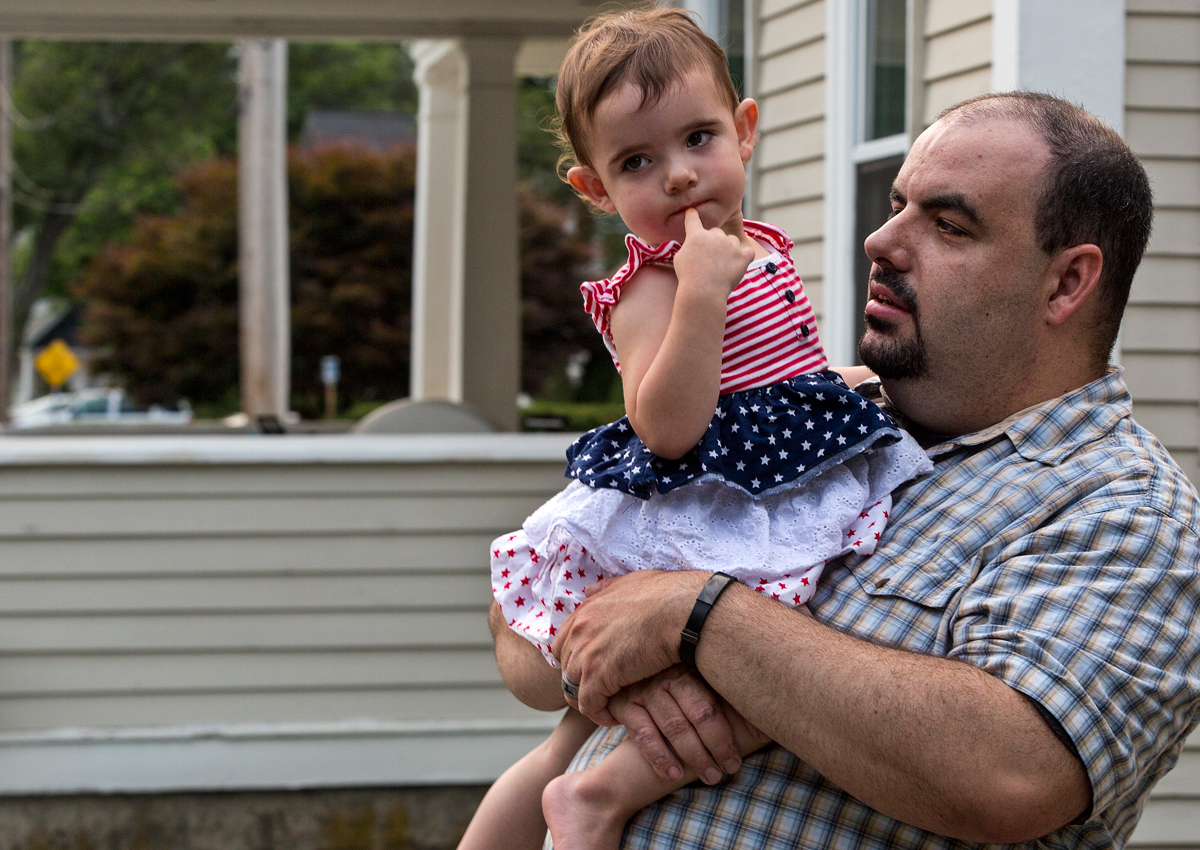 Mike DiGiacomo (with his daughter Mikayla) owes nearly $100,000 in loans for his studies at New England Institute of Art. He has not been able to get a job related to his degree.