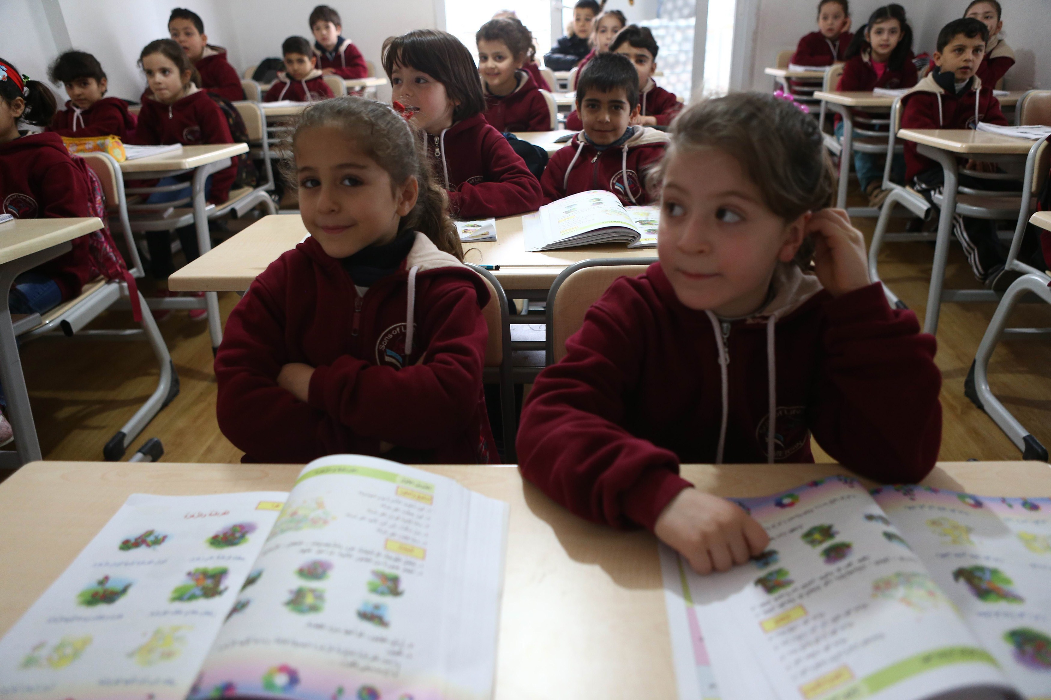 Children listened to their teacher in a Syrian private school in Mersin in March.