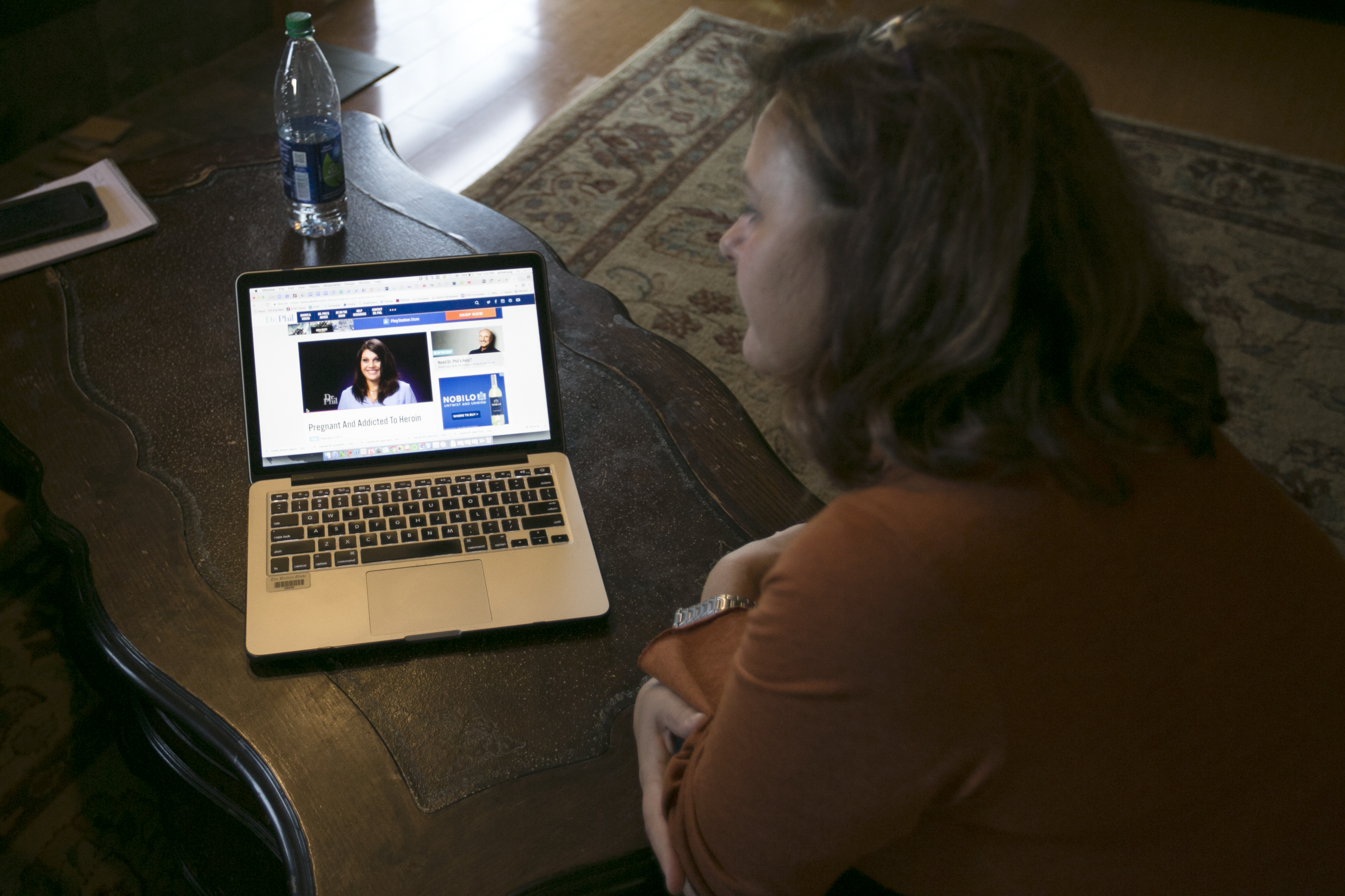 Joelle King-Parrish watched footage from her appearance on the “Dr. Phil” show in her home.