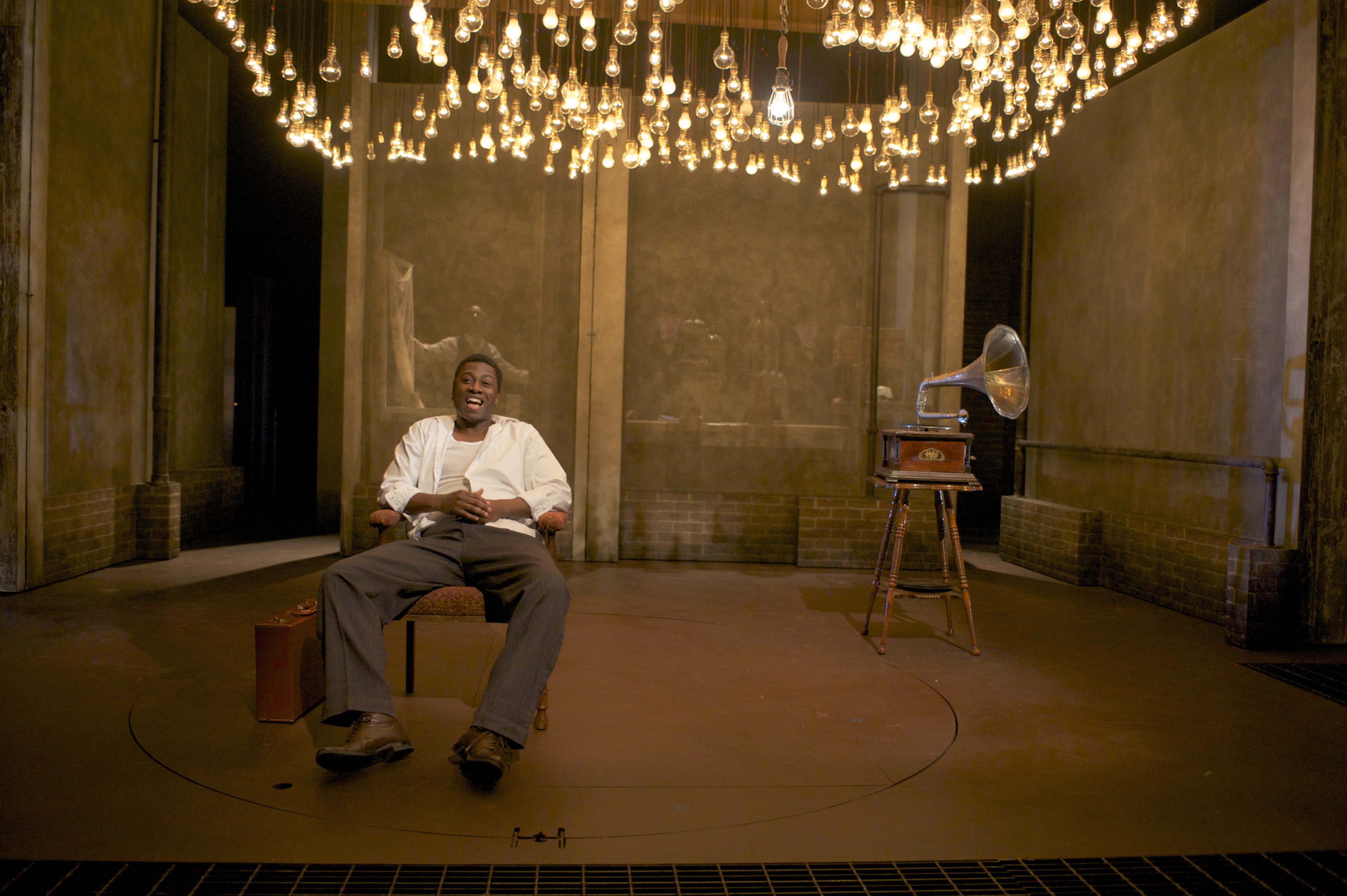 Teagle F. Bougere plays the title character in “Invisible Man.” The set evokes the unnamed man’s basement lair in Harlem, illuminated by 1,369 light bulbs.