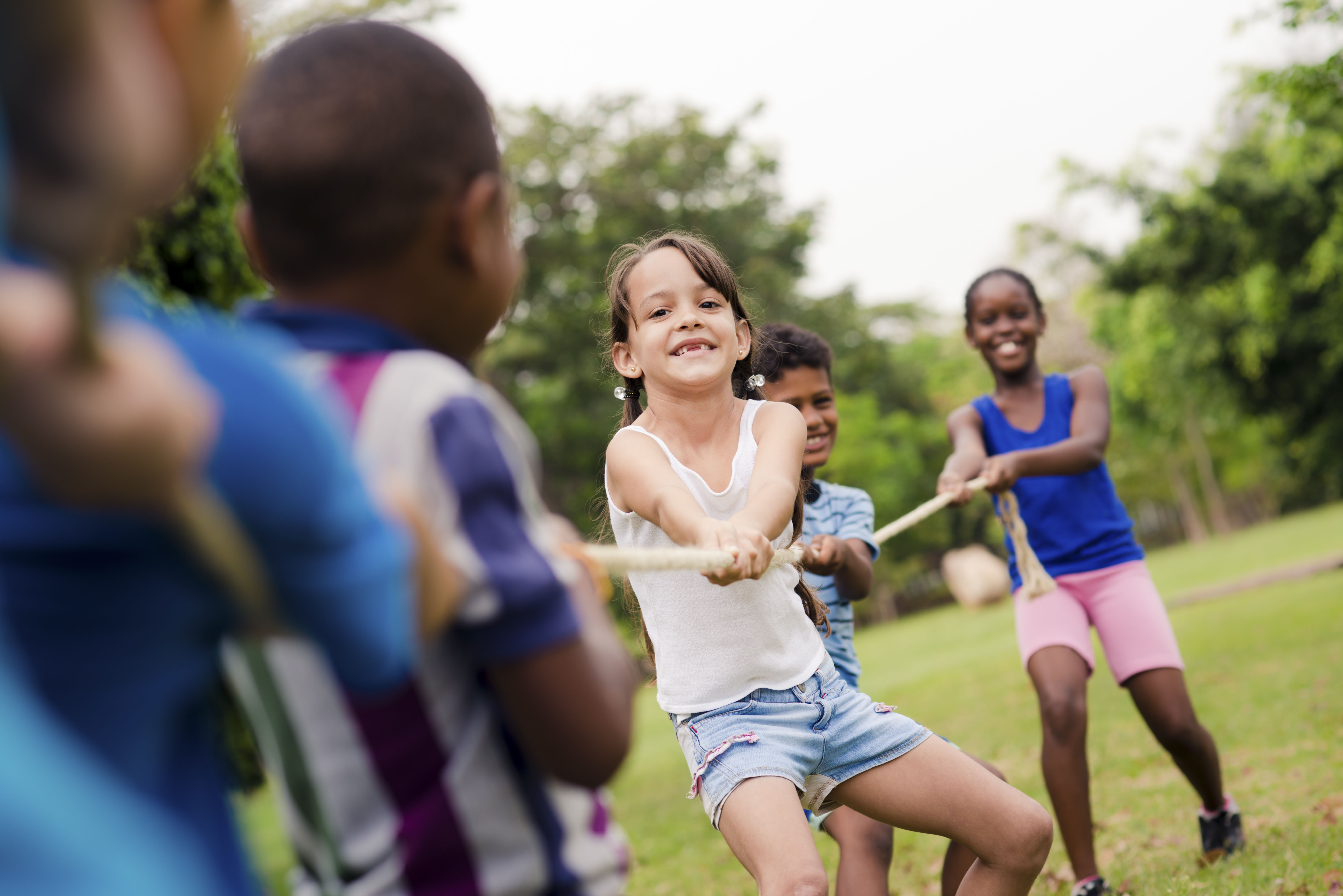 Old-school activity like tug of war helps young campers build valuable life skills and lasting memories.