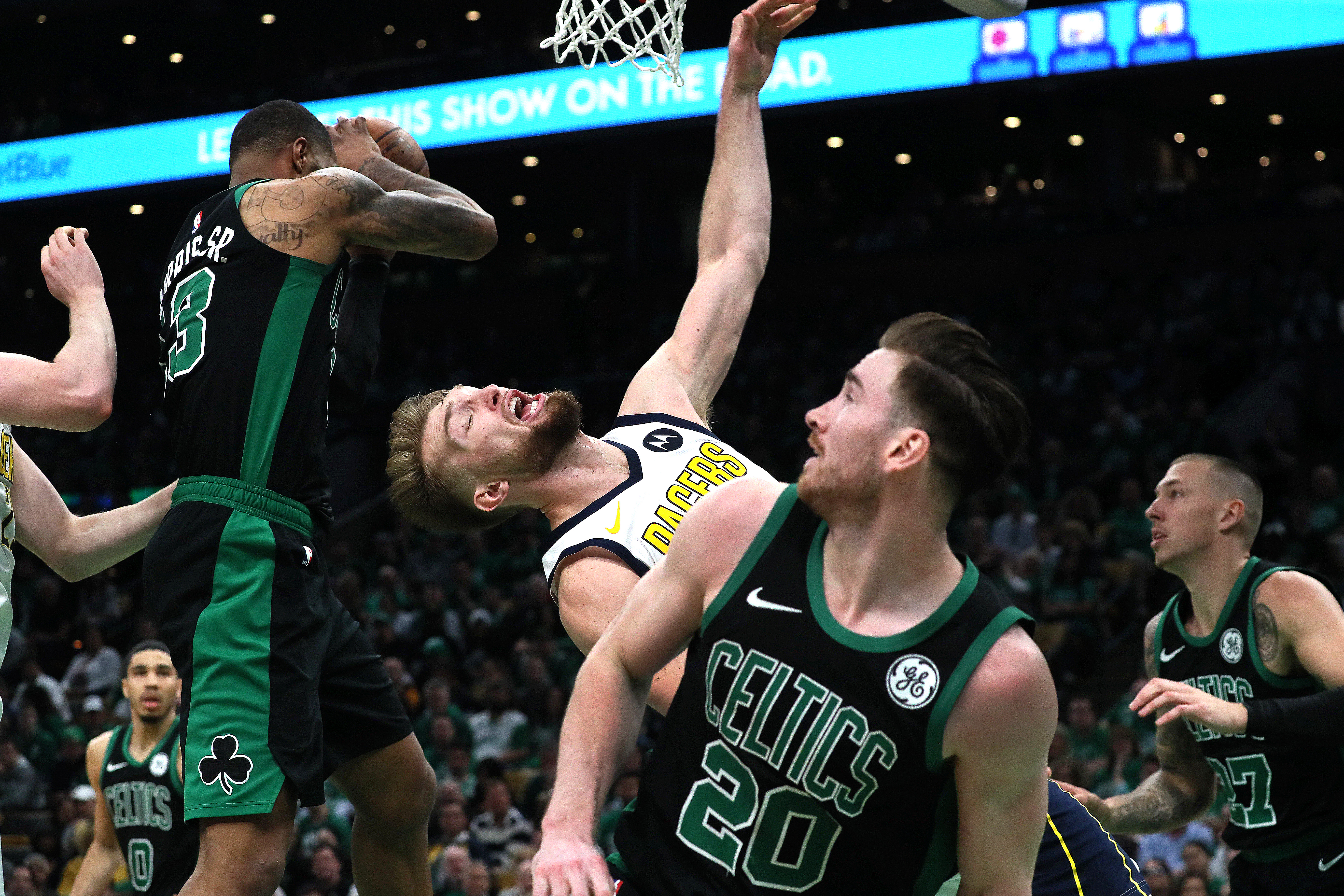 Showing off their defense, the Celtics’ Marcus Morris (left) blocks a shot by Indiana’s Domantas Sabonis.