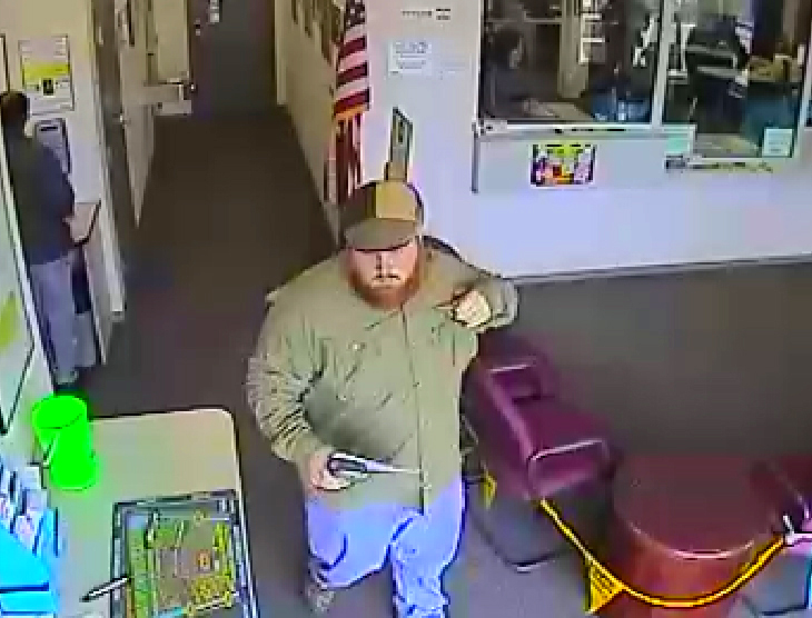 Nathaniel Brudnick is seen on surveillance video cashing in winning tickets at the lottery’s Woburn office.