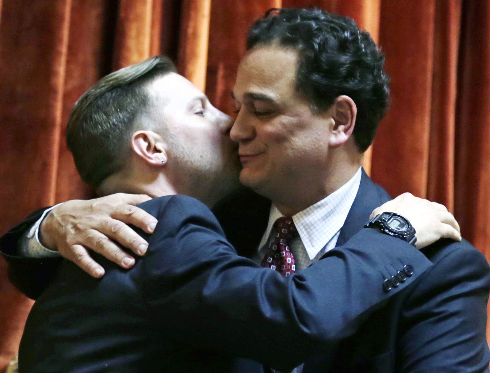 Rhode Island House Speaker Gordon Fox (right) embraced his partner, Marcus LaFond, after the vote.