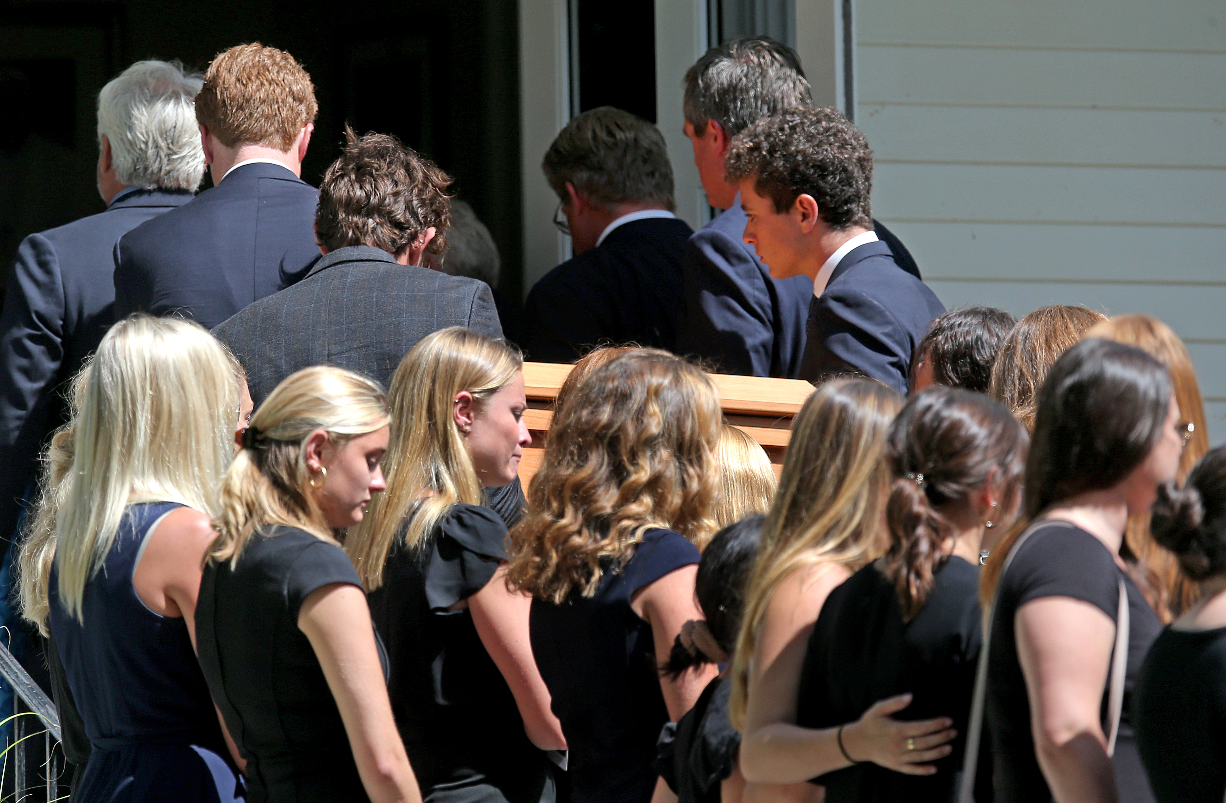 The casket of Saoirse Roisin Kennedy Hill entered the church.