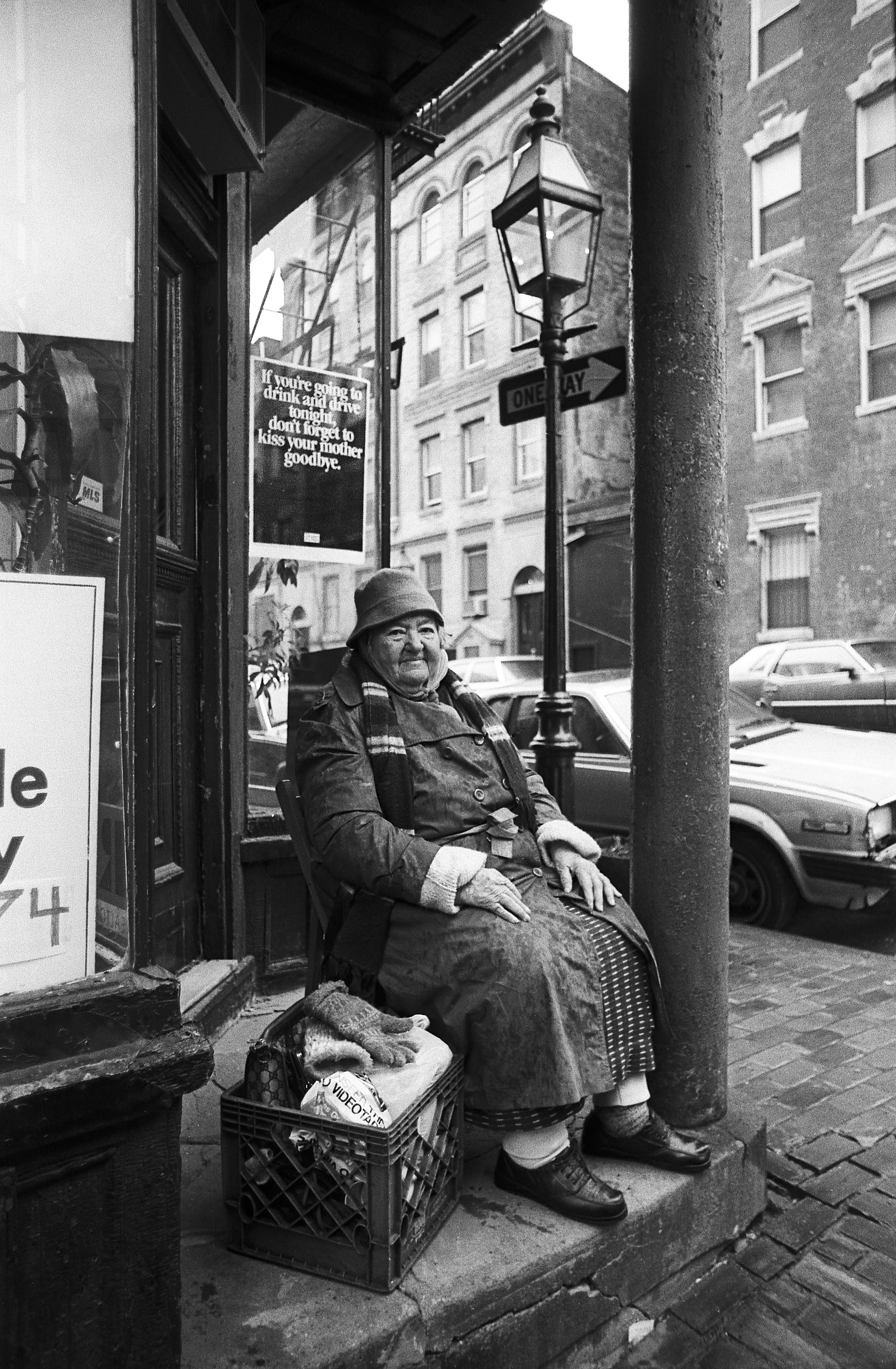 An image of Lillian McGillicuddy, who as a messenger held packages for residents in her Beacon Hill neighborhood, from “Dirty Old Boston.”