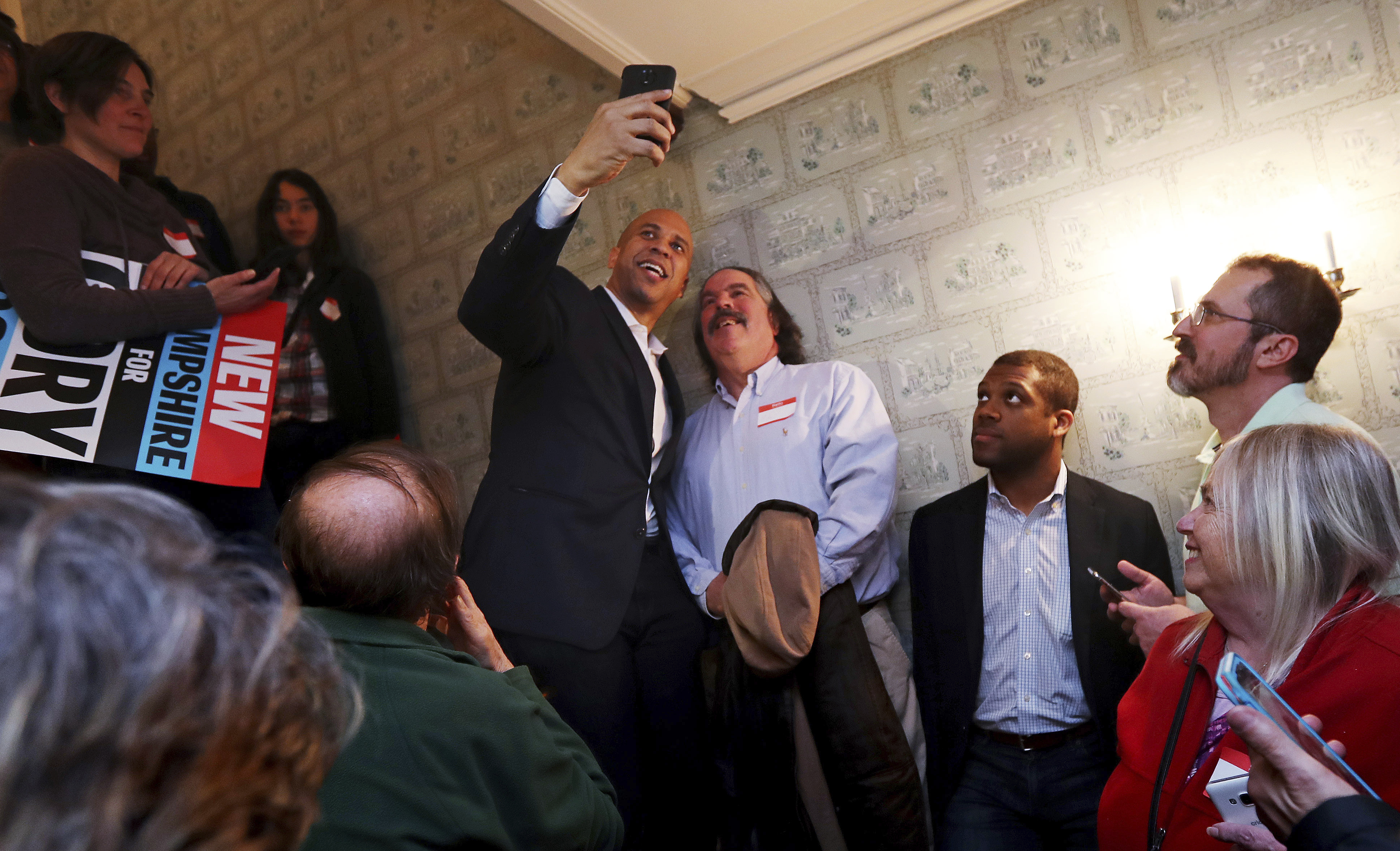 Cory Booker, 2020 Democratic presidential candidate and senator, took a selfie at a house party during a campaign stop in Claremont, N.H., Friday.