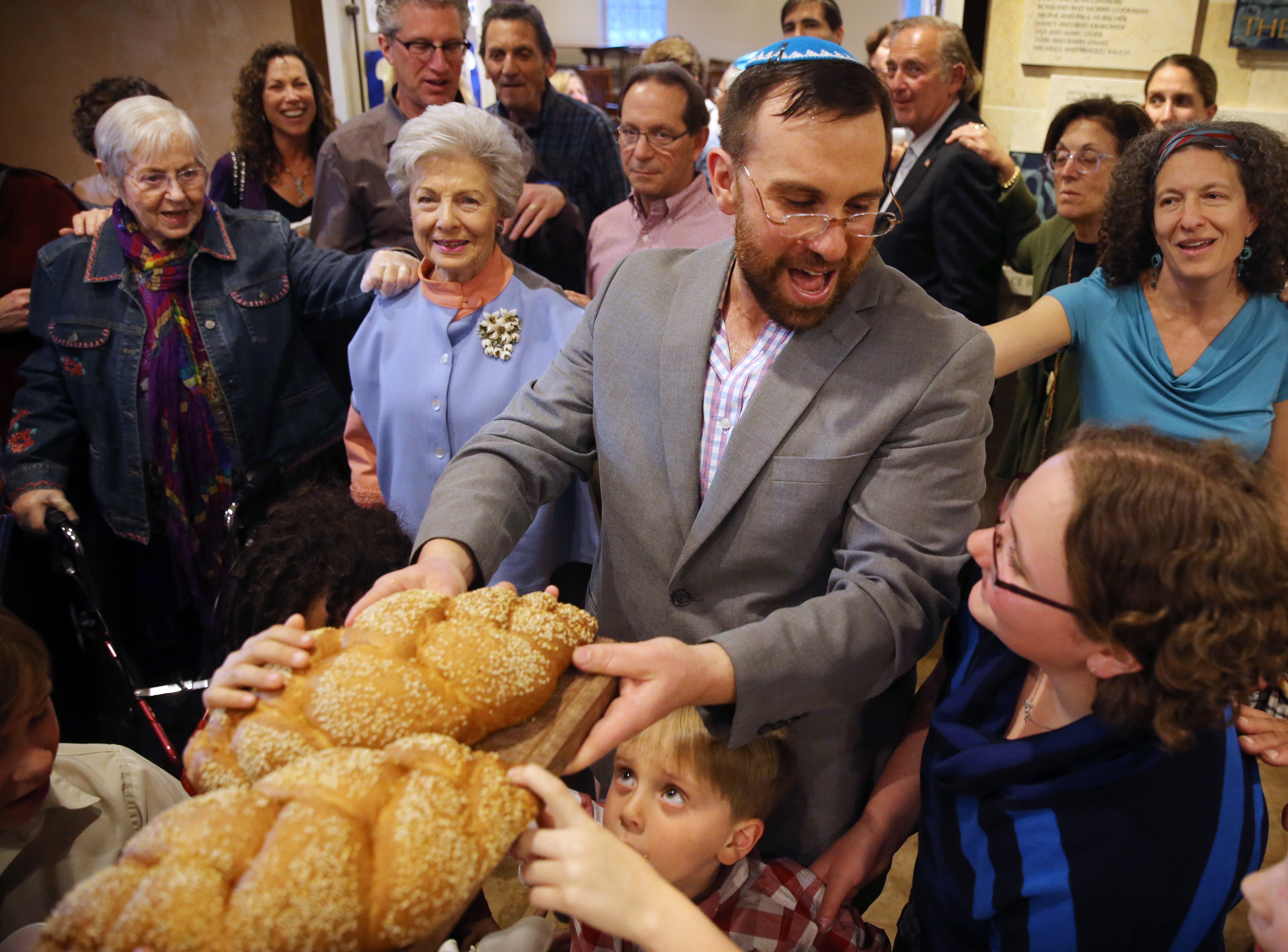 Rabbi David Fainsilber offered a blessing during the Kiddush and HaMotzi rituals in Stowe, Vt.