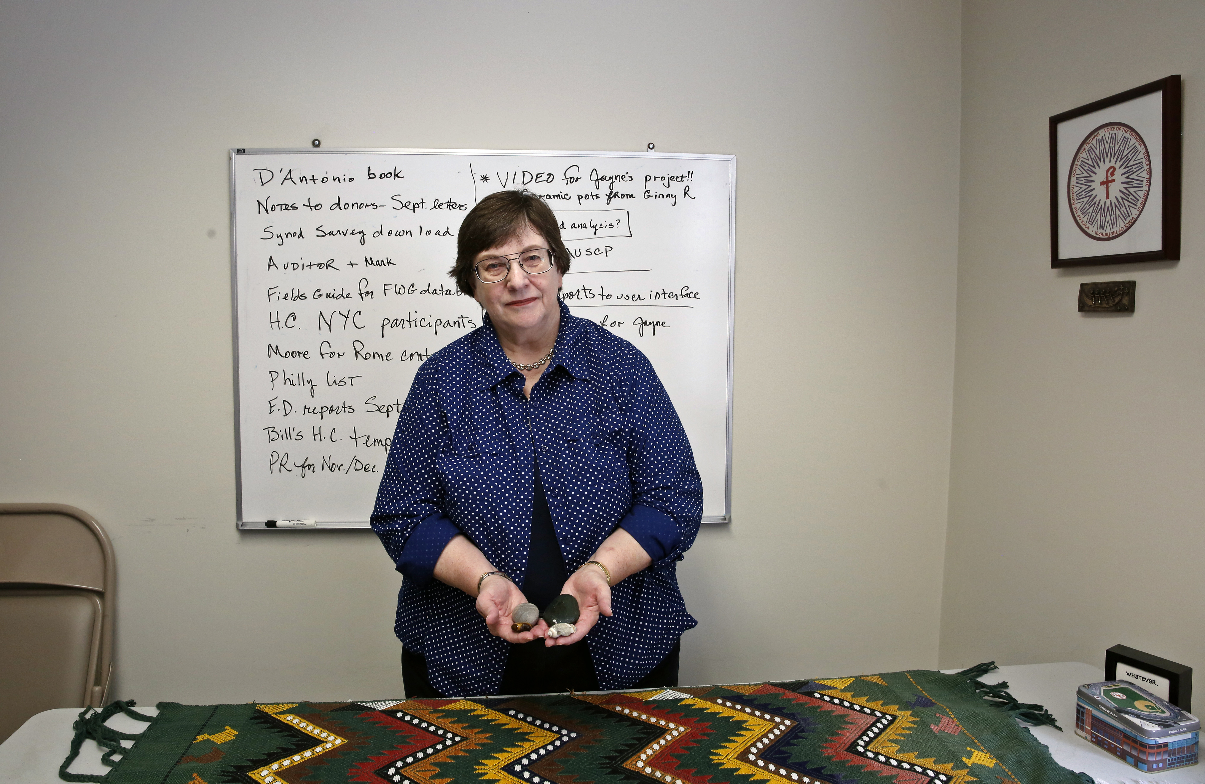 Donna Doucette, executive director of VOTF, holds objects used as “talking pieces” in healing circles.
