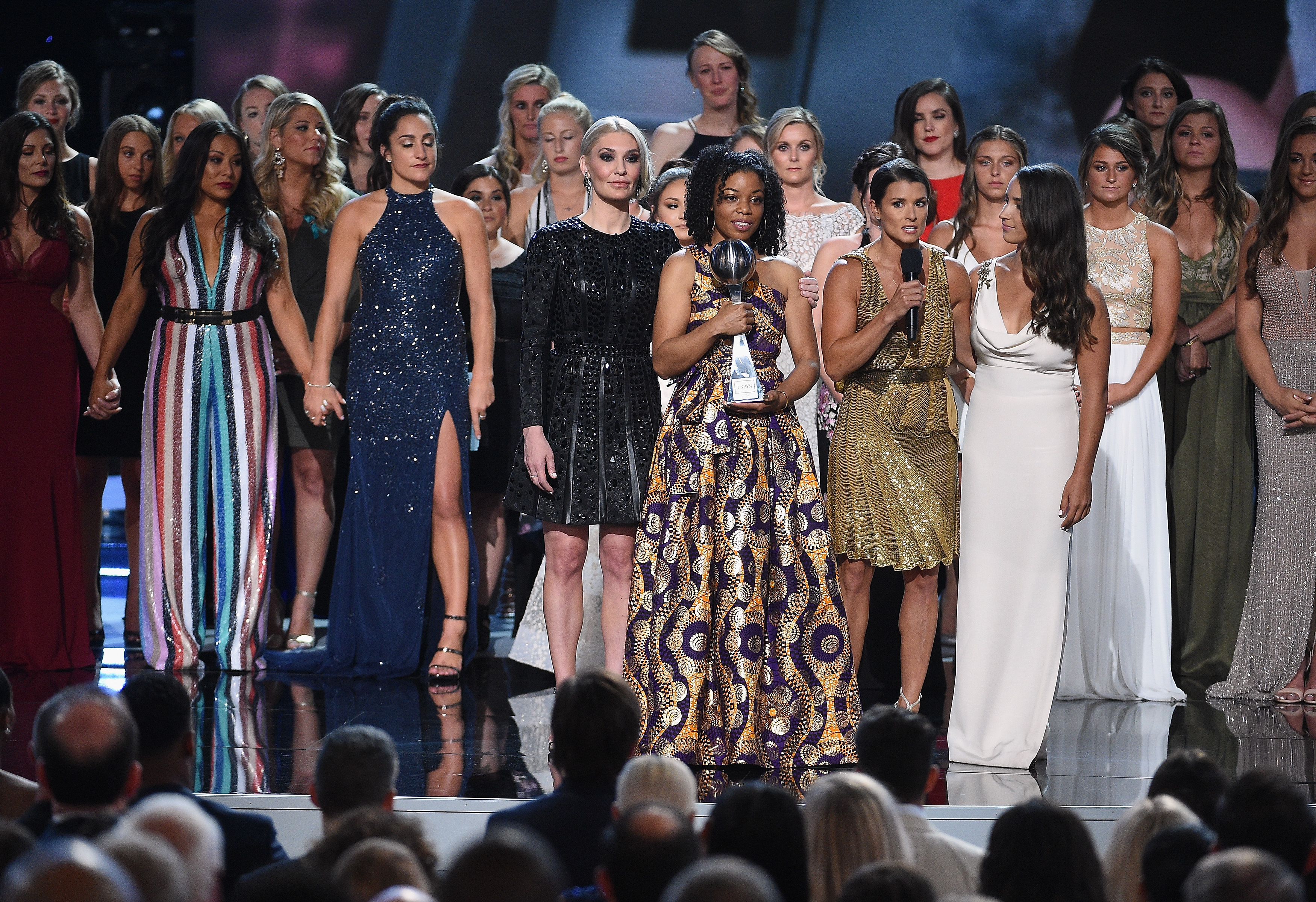 Host Danica Patrick, Sarah Klein, Tiffany Thomas Lopez, Aly Raisman and recipients of the Arthur Ashe Award for Courage speak onstage at The 2018 ESPYS at Microsoft Theater on Wednesday in Los Angeles, California.