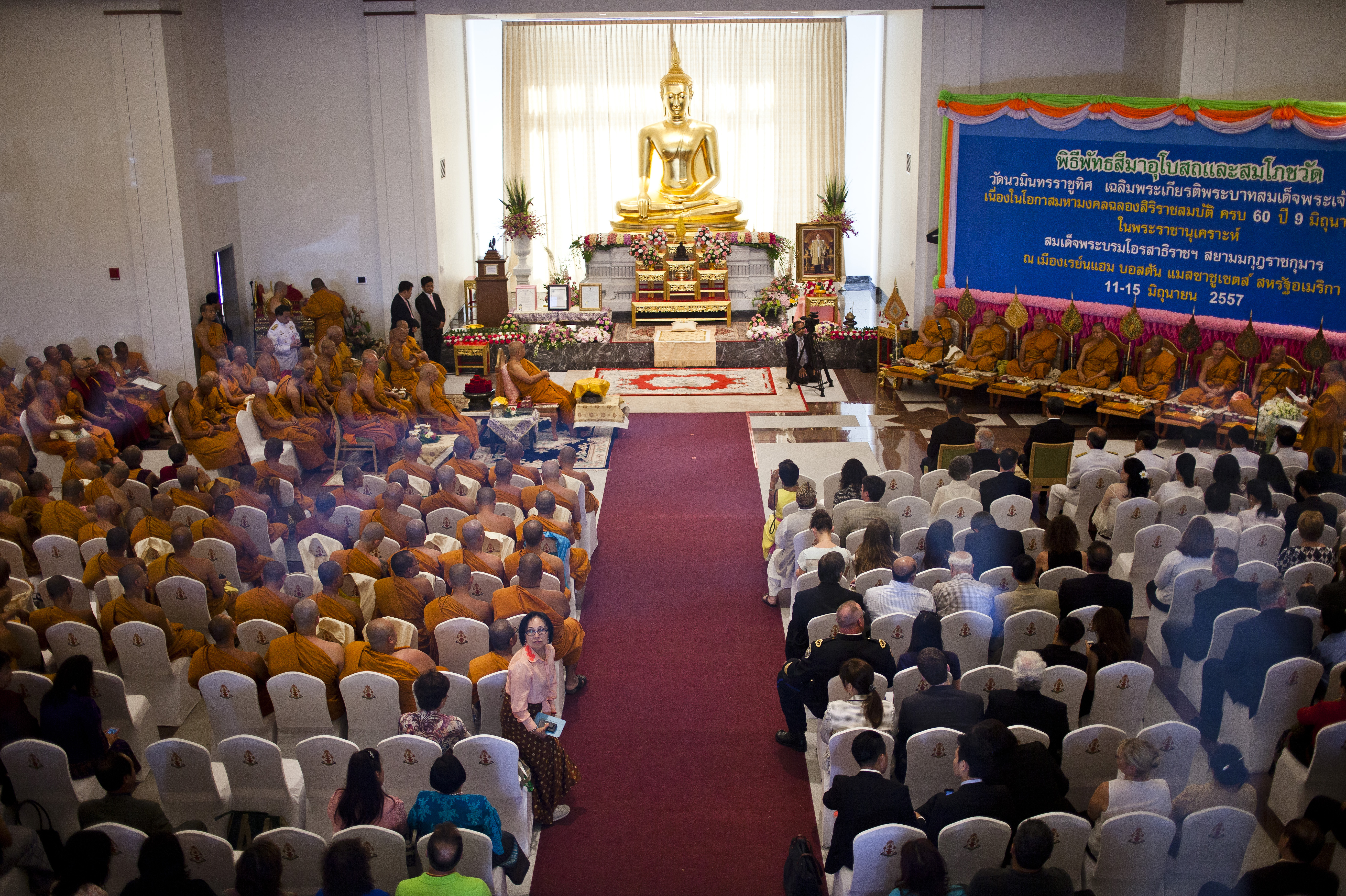 Monks and visitors gathered in the Great Hall at the Wat Nawamintarachutis Thai Buddhist Temple and Meditation Center in Raynham.