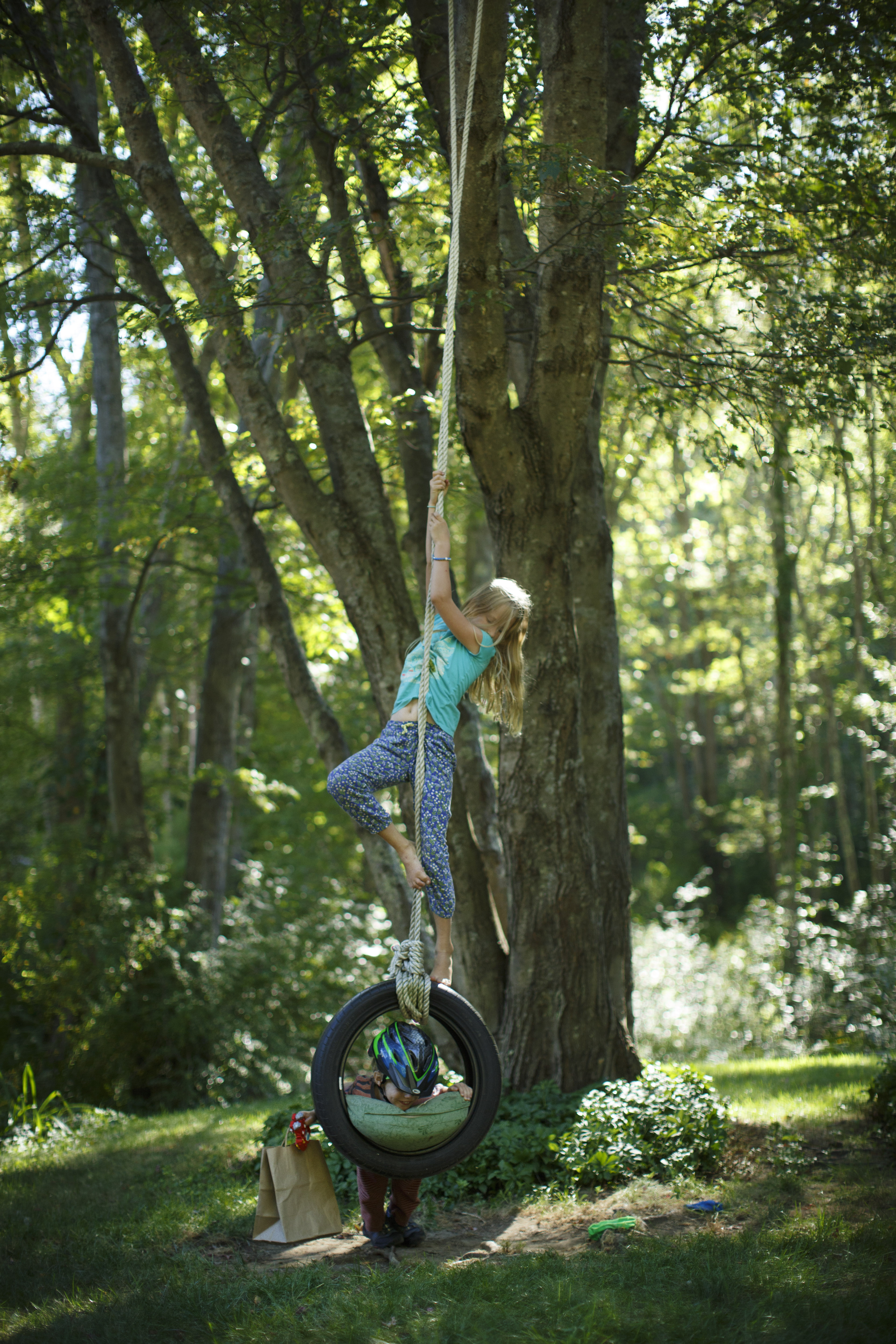 Ava Dennesen played on a tire swing with her brother, Eli.