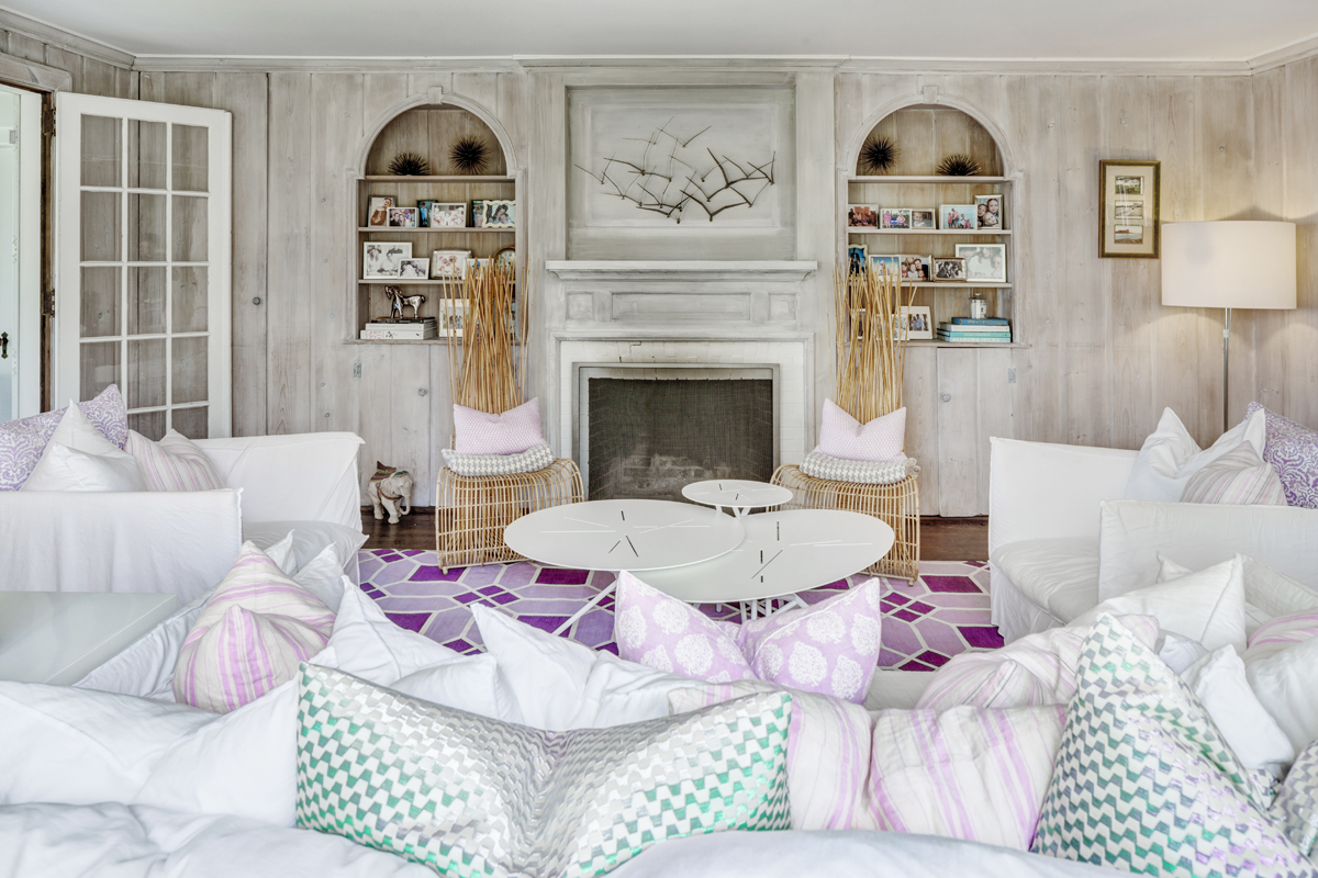 In the living room, throw pillows in a mix of patterns by Missoni Home, John Robshaw Textiles, and Roberta Roller Rabbit are among those piled on the chairs and sofa.