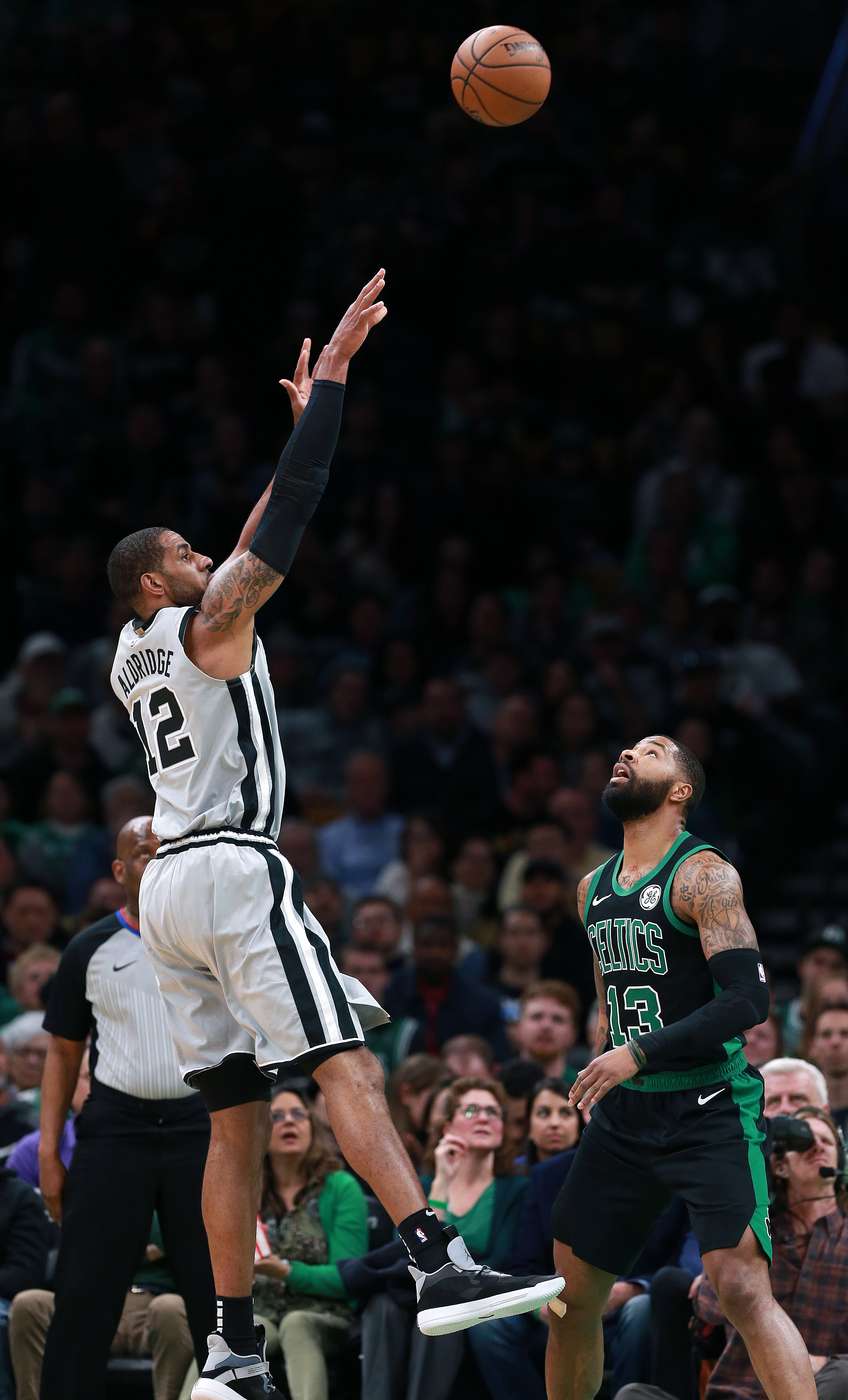 Marcus Morris can only watch as the Spurs’ LaMarcus Aldridge gets off a first quarter shot over him. Aldridge scored 19 points in the quarter.