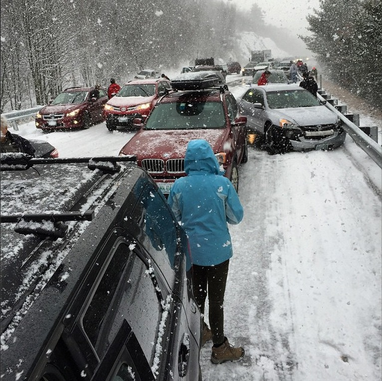 About 35 vehicles crashed in sudden snow on Interstate 93 in Ashland, N.H., on Friday, including a truck that caught fire. One person suffered serious injuries.