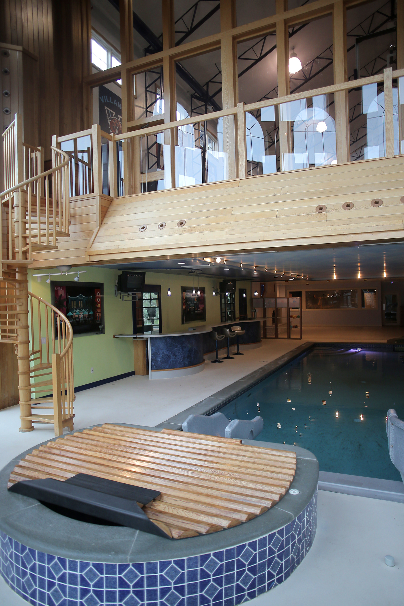 The hot tub, pool, bar, and balcony.