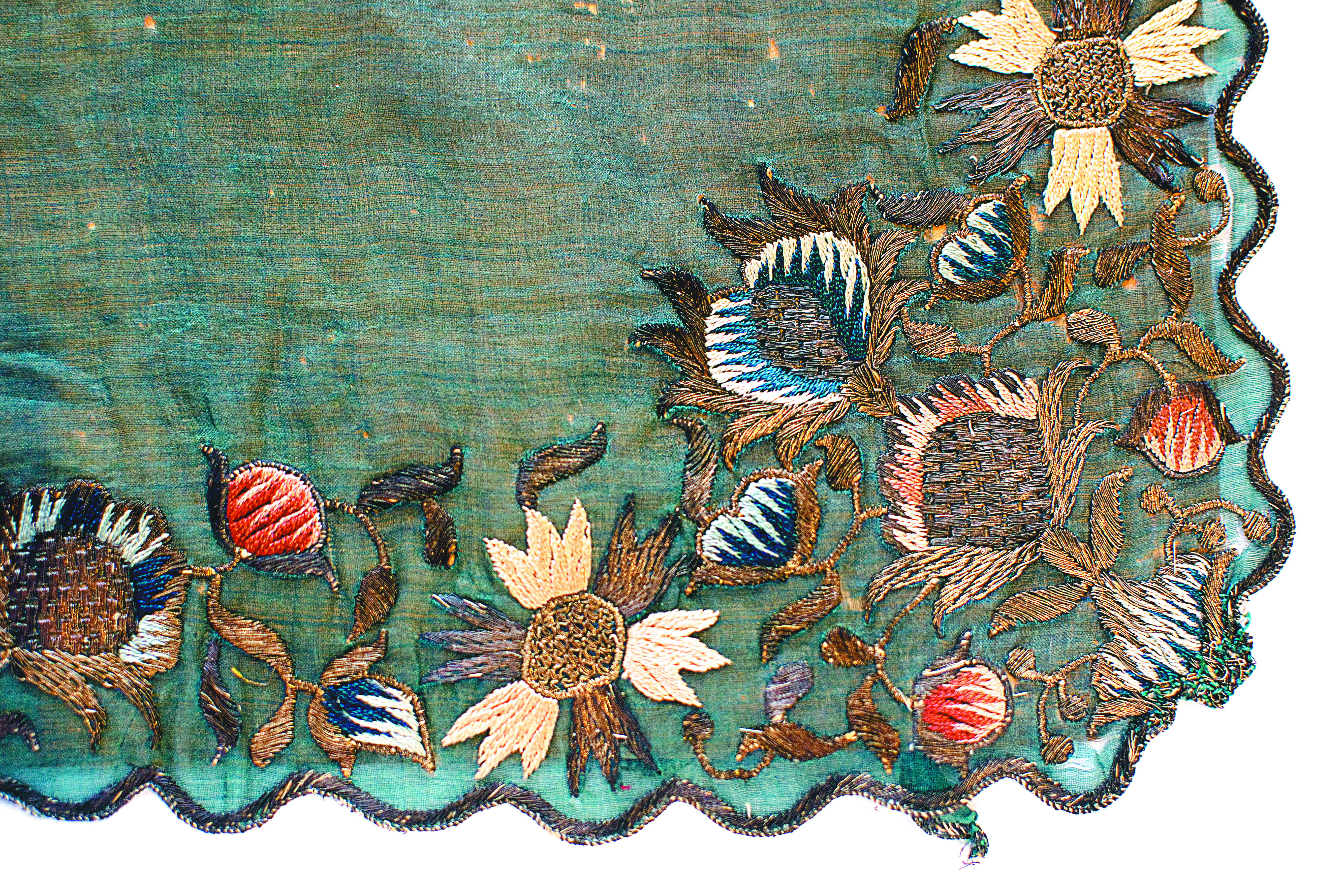 A detail of the intricate embroidery on an ornate scarf.
