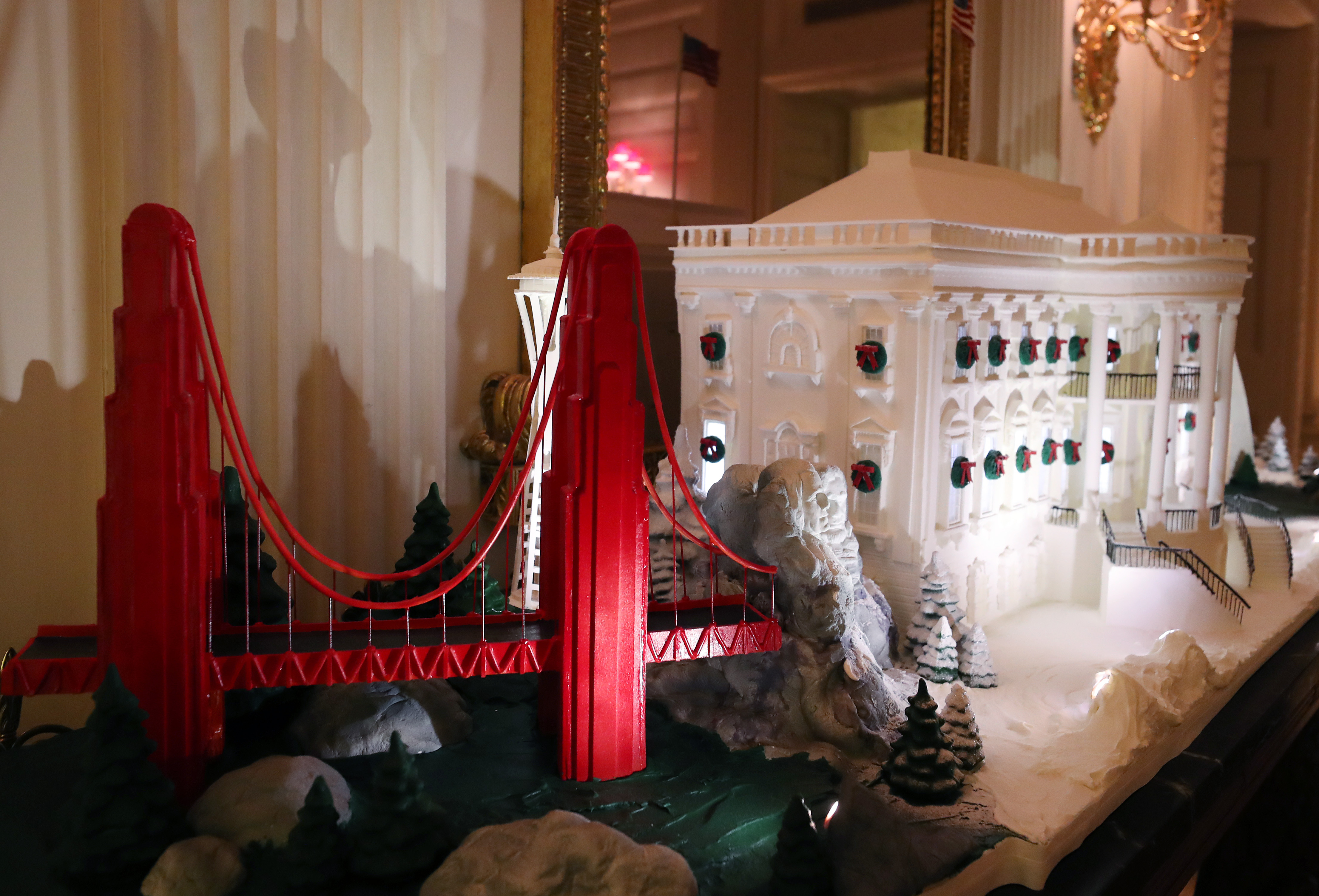 A model of the Golden Gate Bridge stood next to a Ginger Bread White House in the State Dining Room.