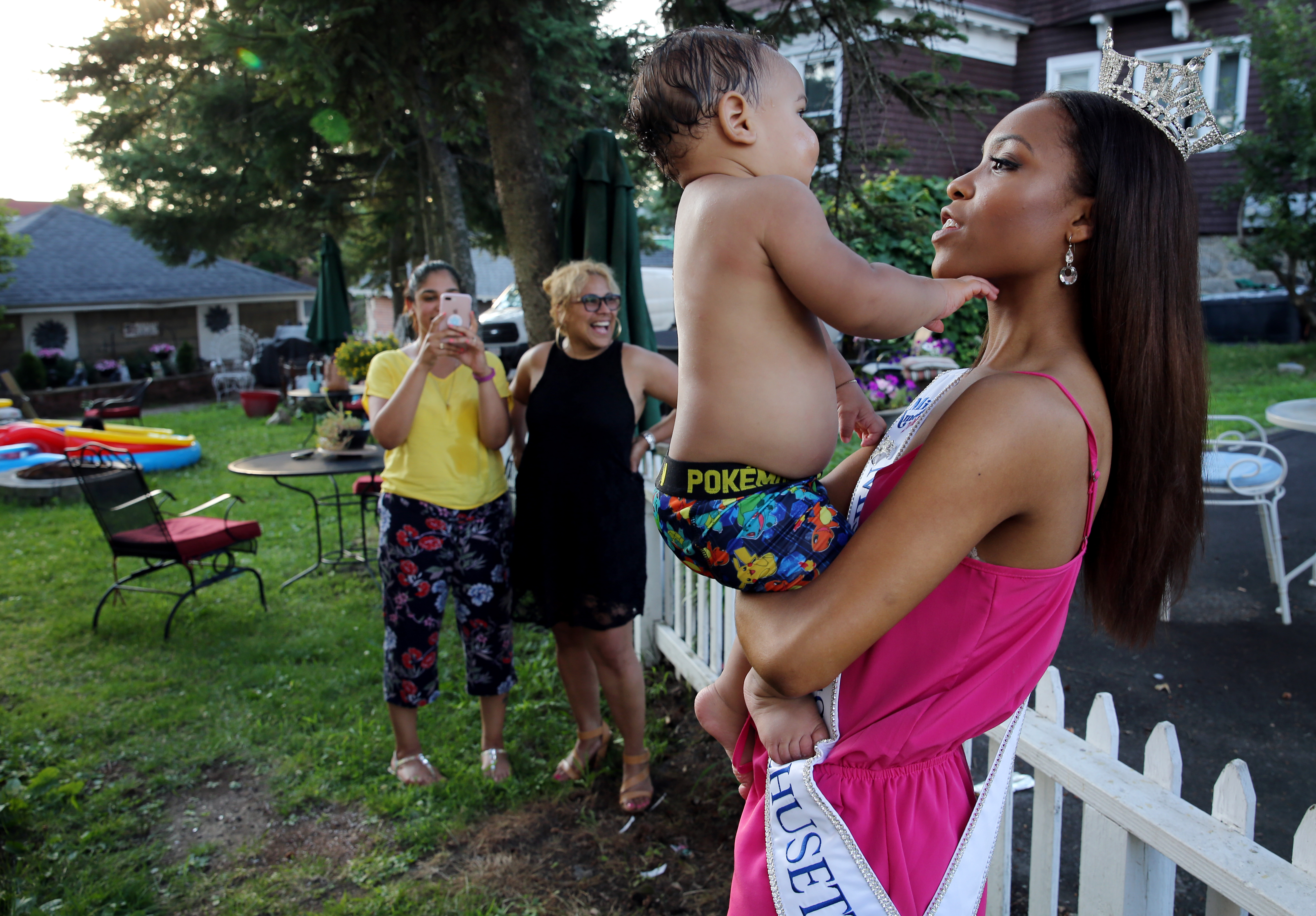Gabriela Taveras greets her nephew David Rondon at her home in Lawrence on Tuesday.