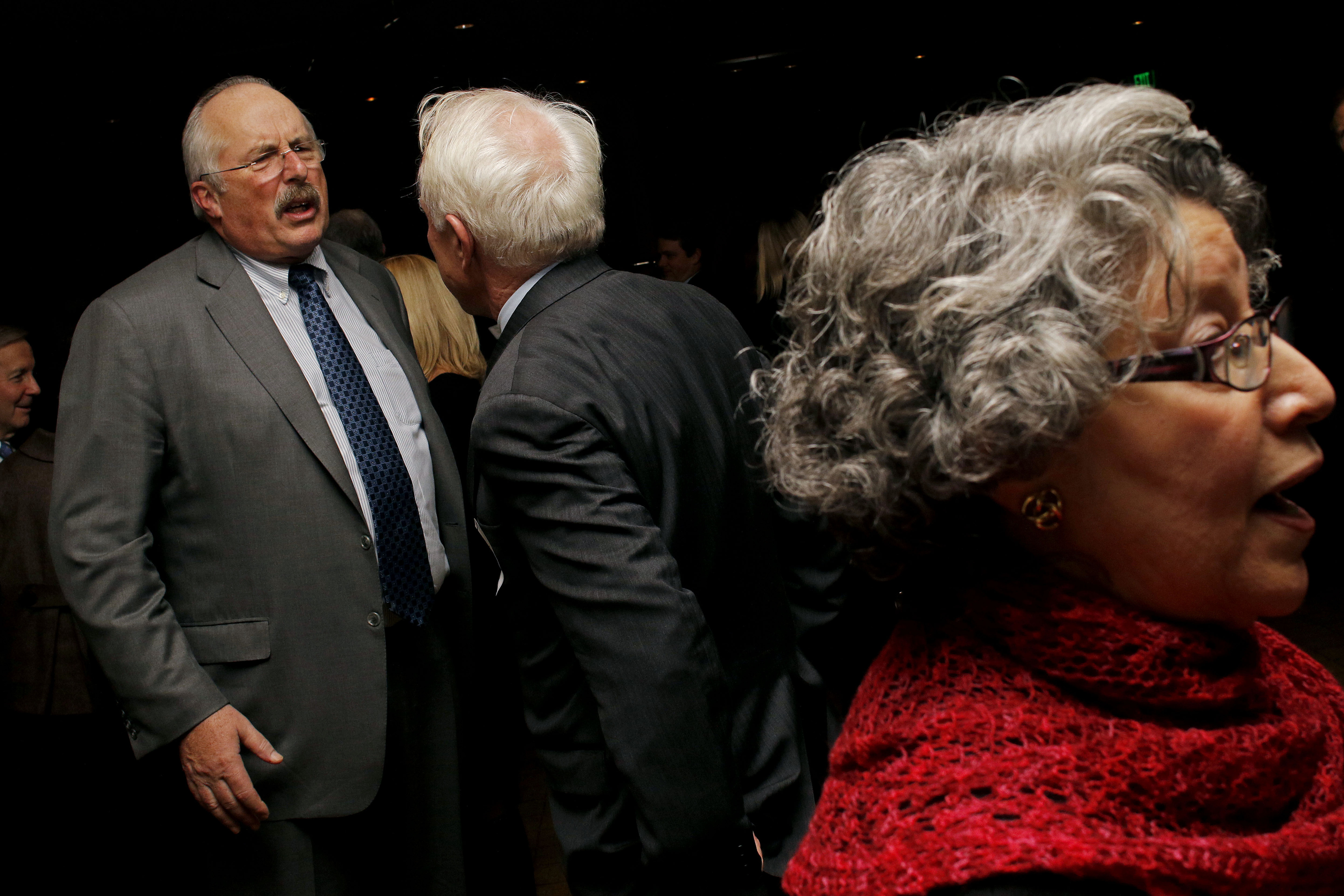 Torchiana is easily spotted in a crowd with his linebacker’s build, trimmed mustache, wire-rimmed glasses, and receding hairline.