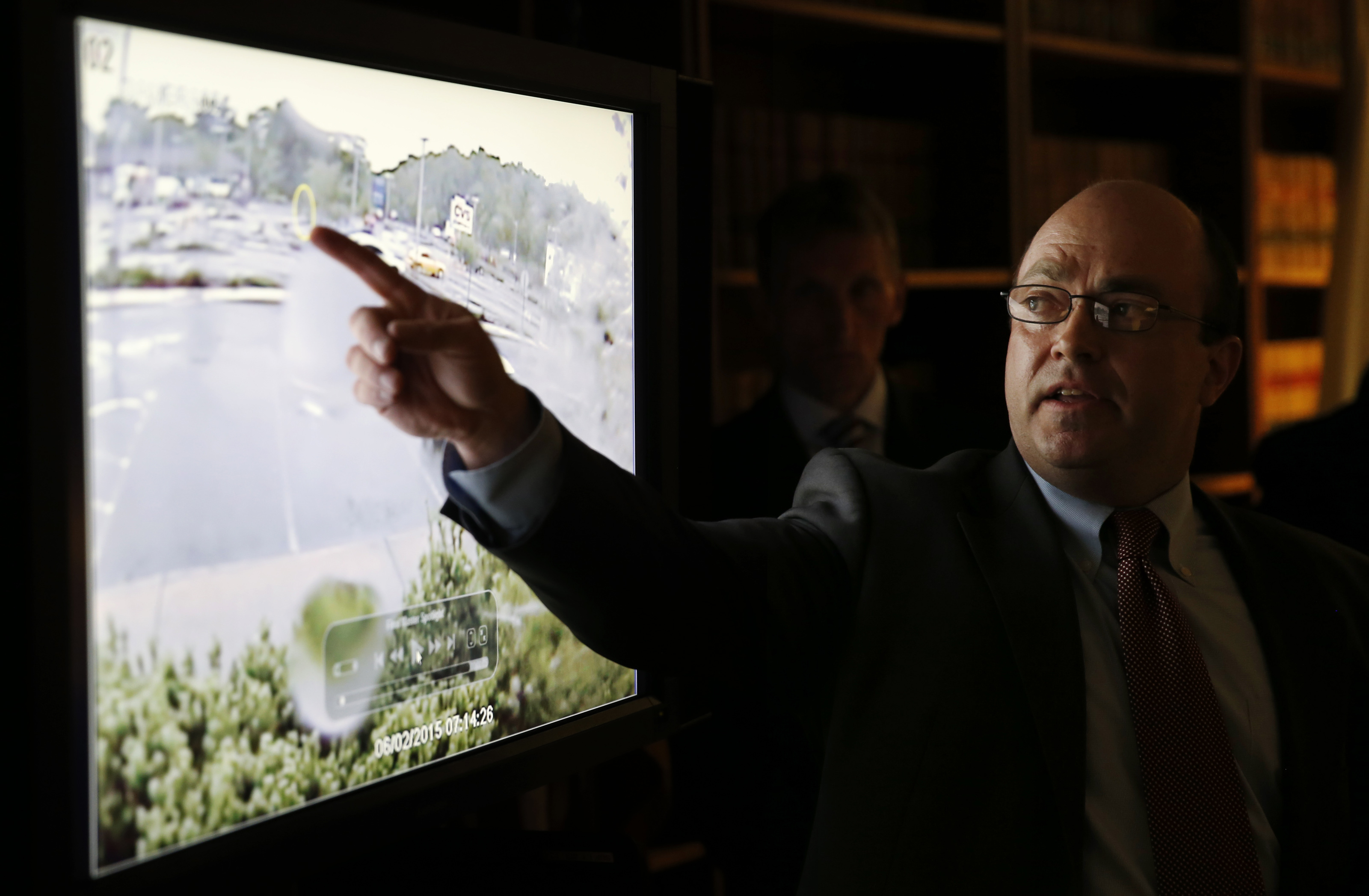 Assistant District Attorney Patrick Haggan pointed to the video has it was shown at a news conference Monday.
