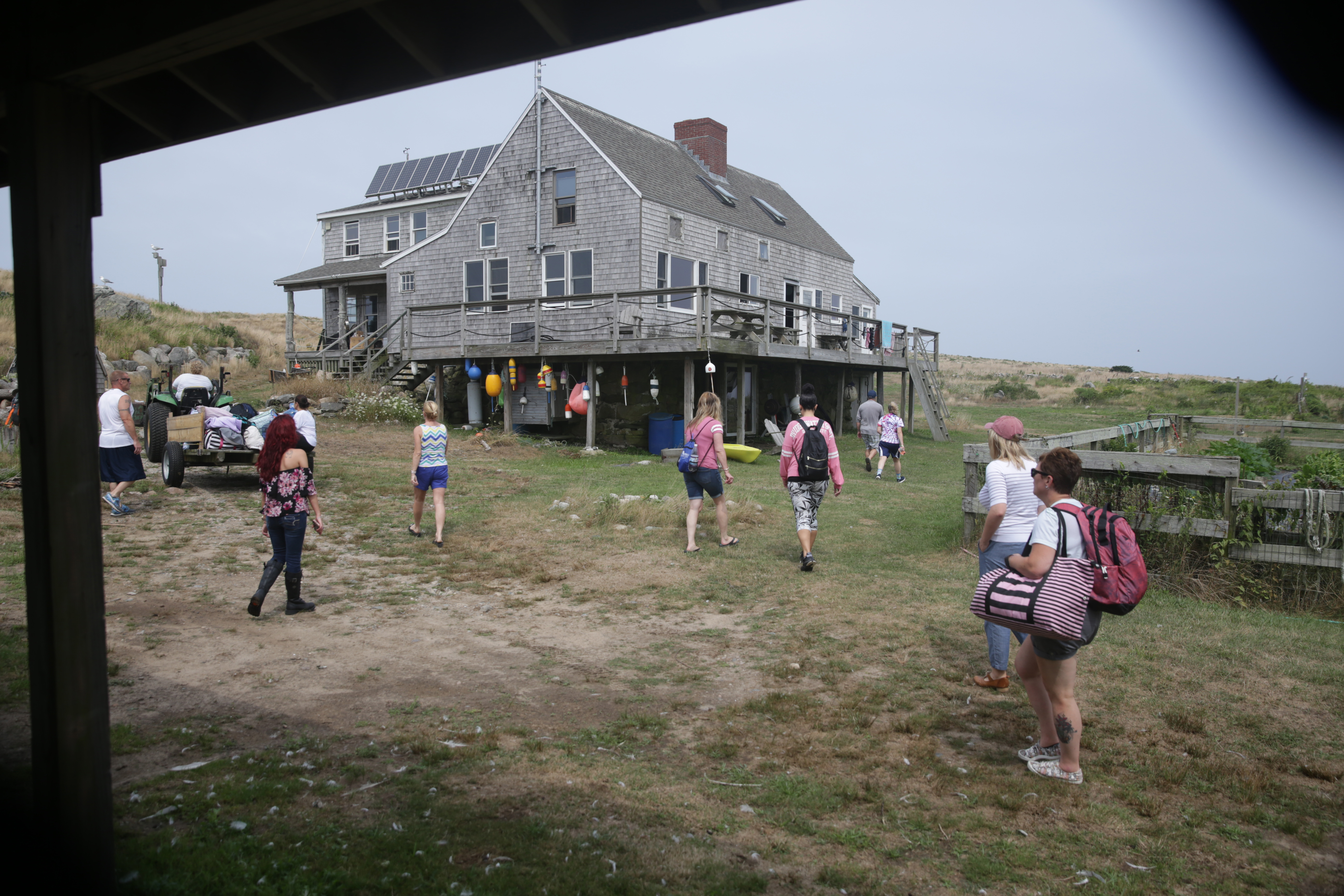 A retreat group arrived at the main house on the island for a temporary stay. Penikese Island School is seeking to turn the site into a year-round residential center.
