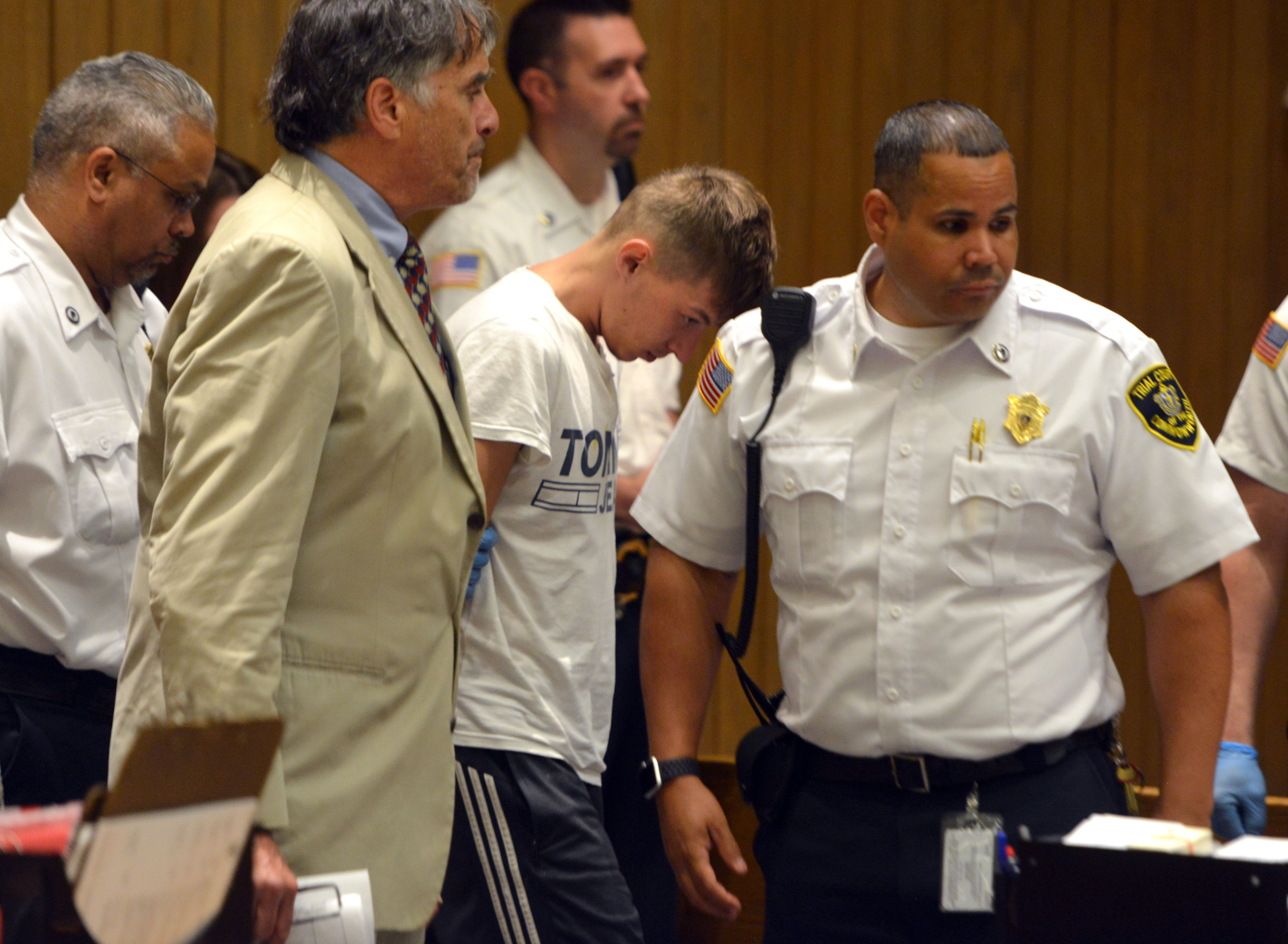 Volodymyr Zhukovskyy (center), of West Springfield, was escorted into the courtroom Monday.