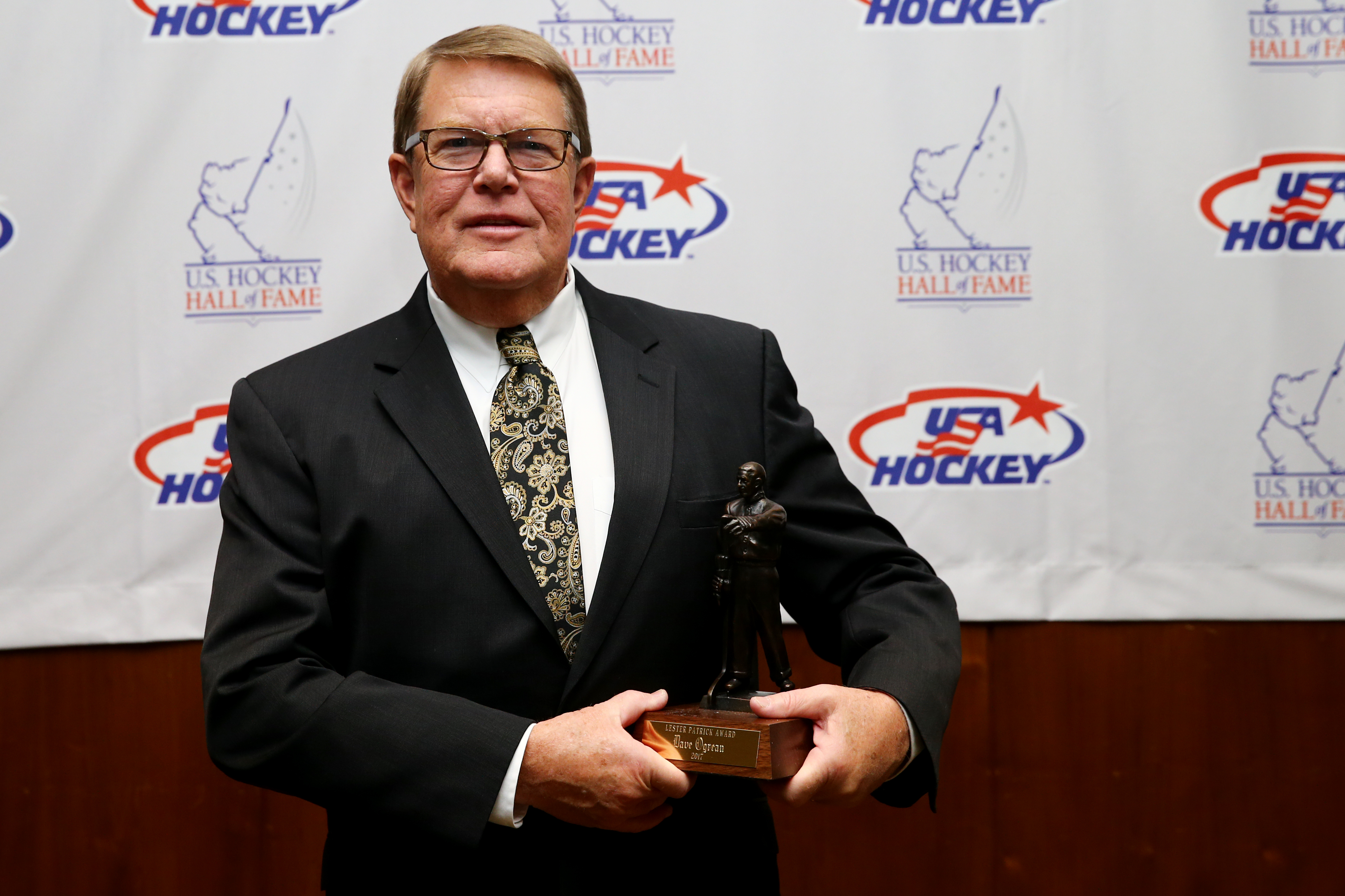 Dave Ogrean received the 2017 Lester Patrick Trophy for outstanding service to hockey at the U.S. Hockey Hall of Fame Induction in Boston on Dec. 13.