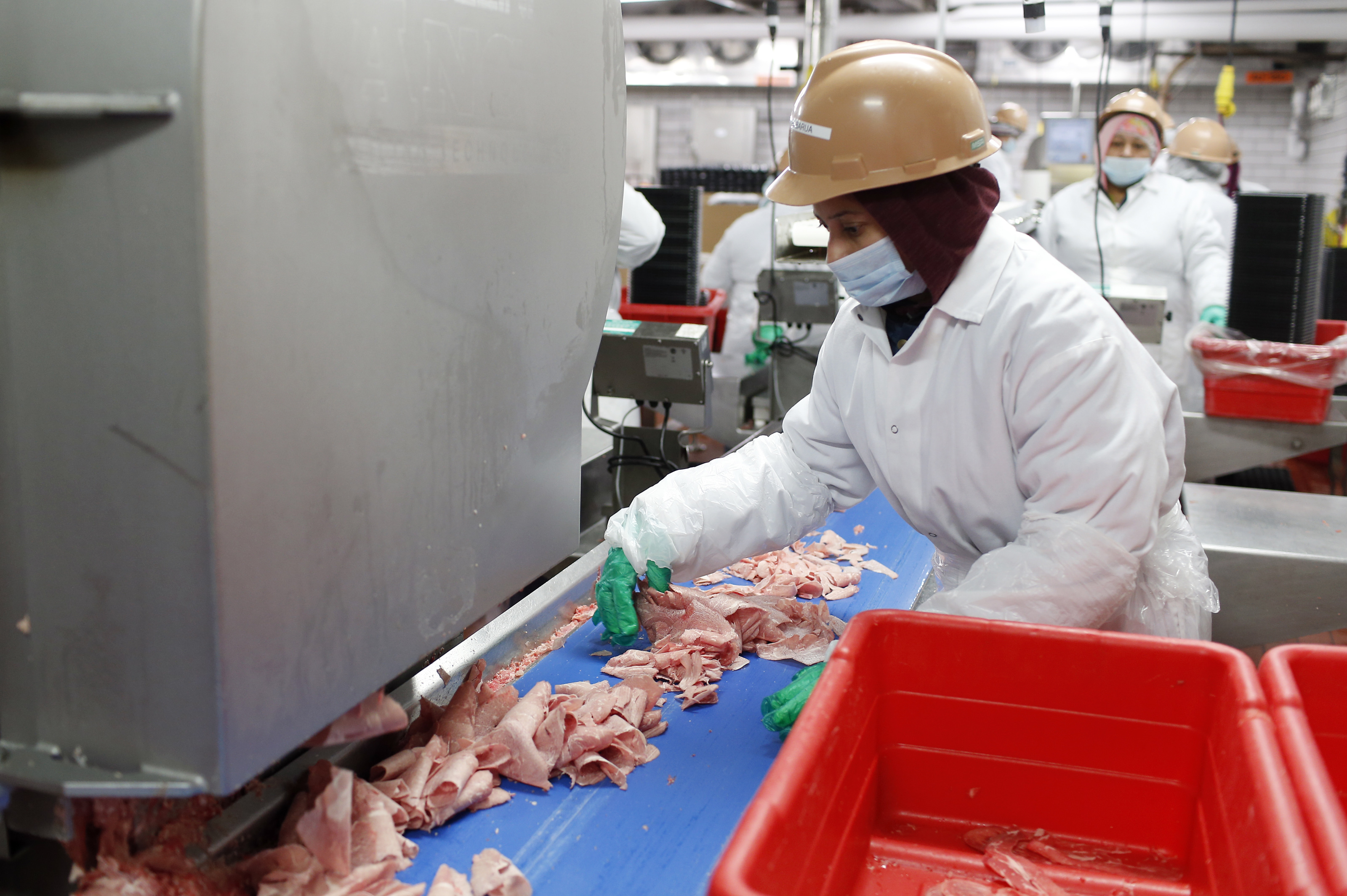 A worker sorted shaved beef at the plant in Lynn.