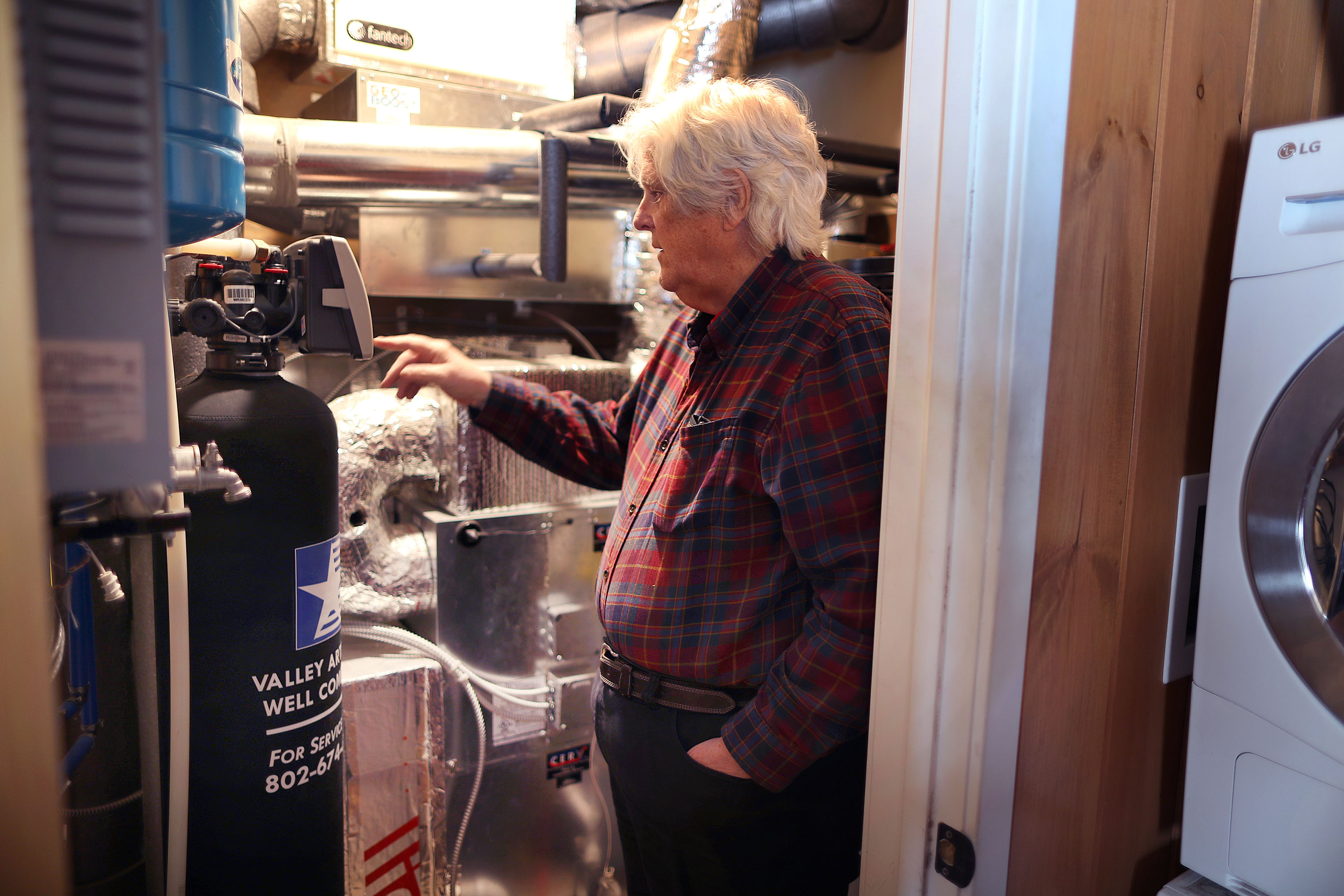 Andy McLaughlin inspected the energy system in his zero-emissions prefab home that was built in 2015 in Woodstock.