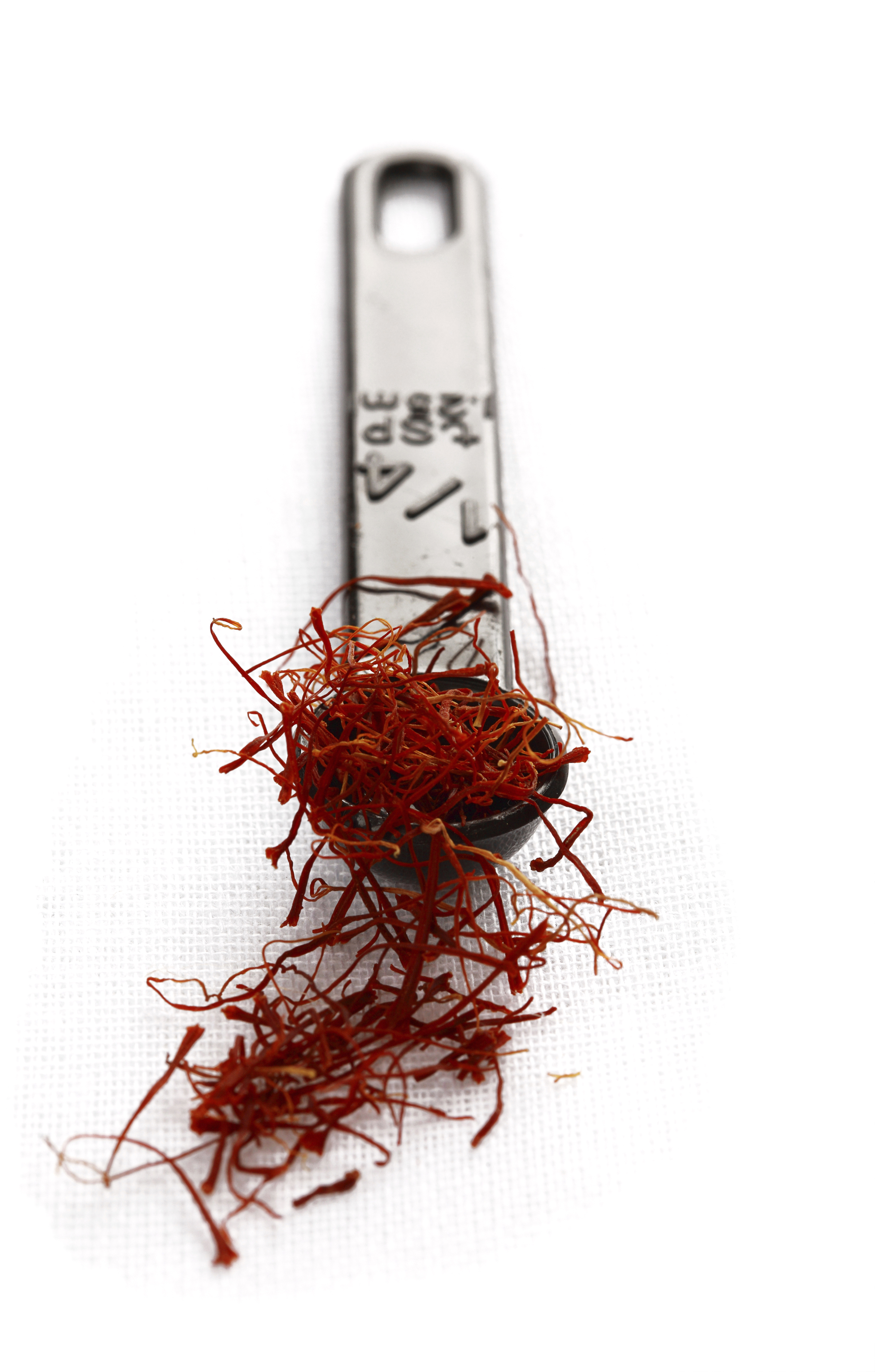 Saffron on a measuring spoon.
