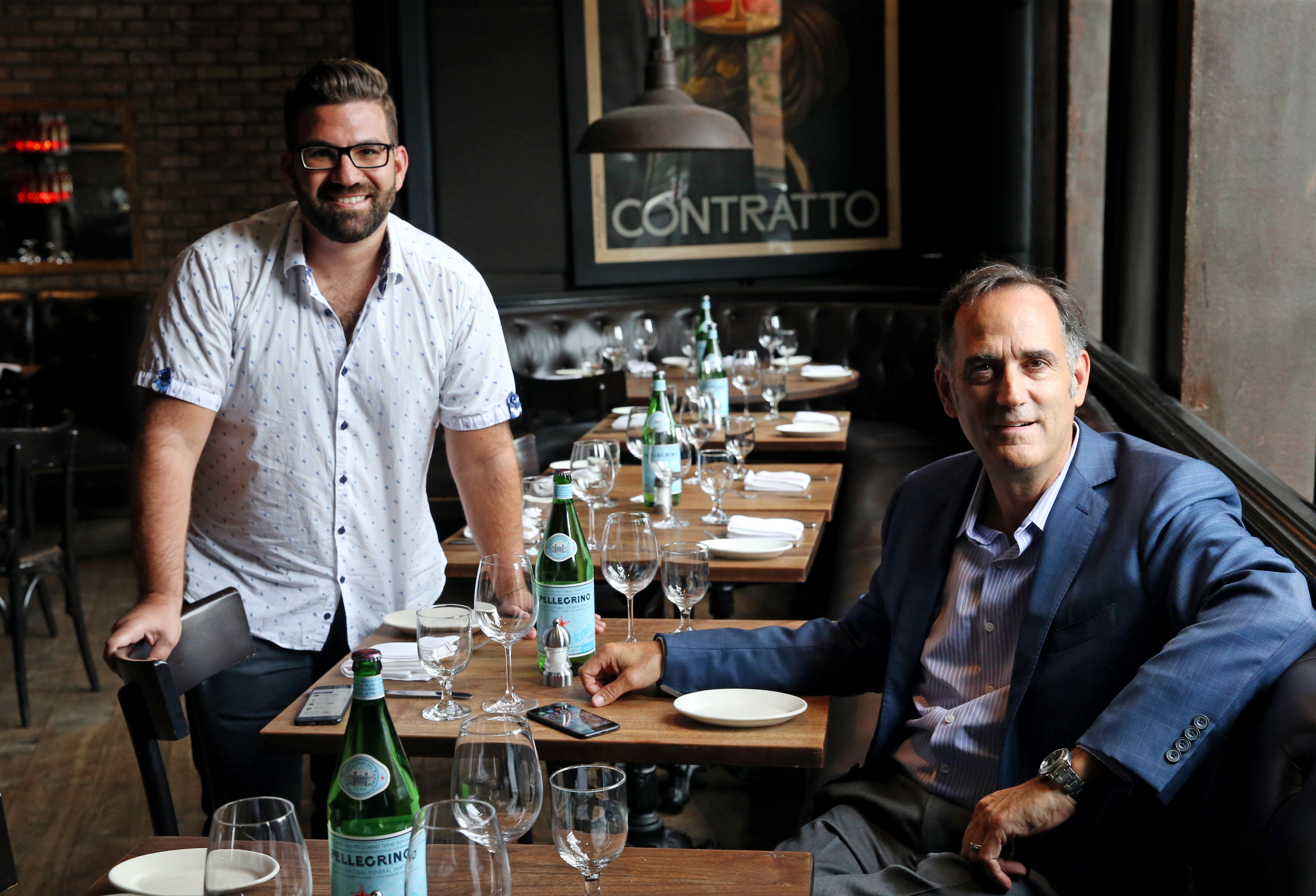 Nick Belsito, (left) CEO of OpenCity, and Jeff Gates, owner of Aquitaine Group, at Cinquecento, where Belsito demonstrated the OpenCity app.