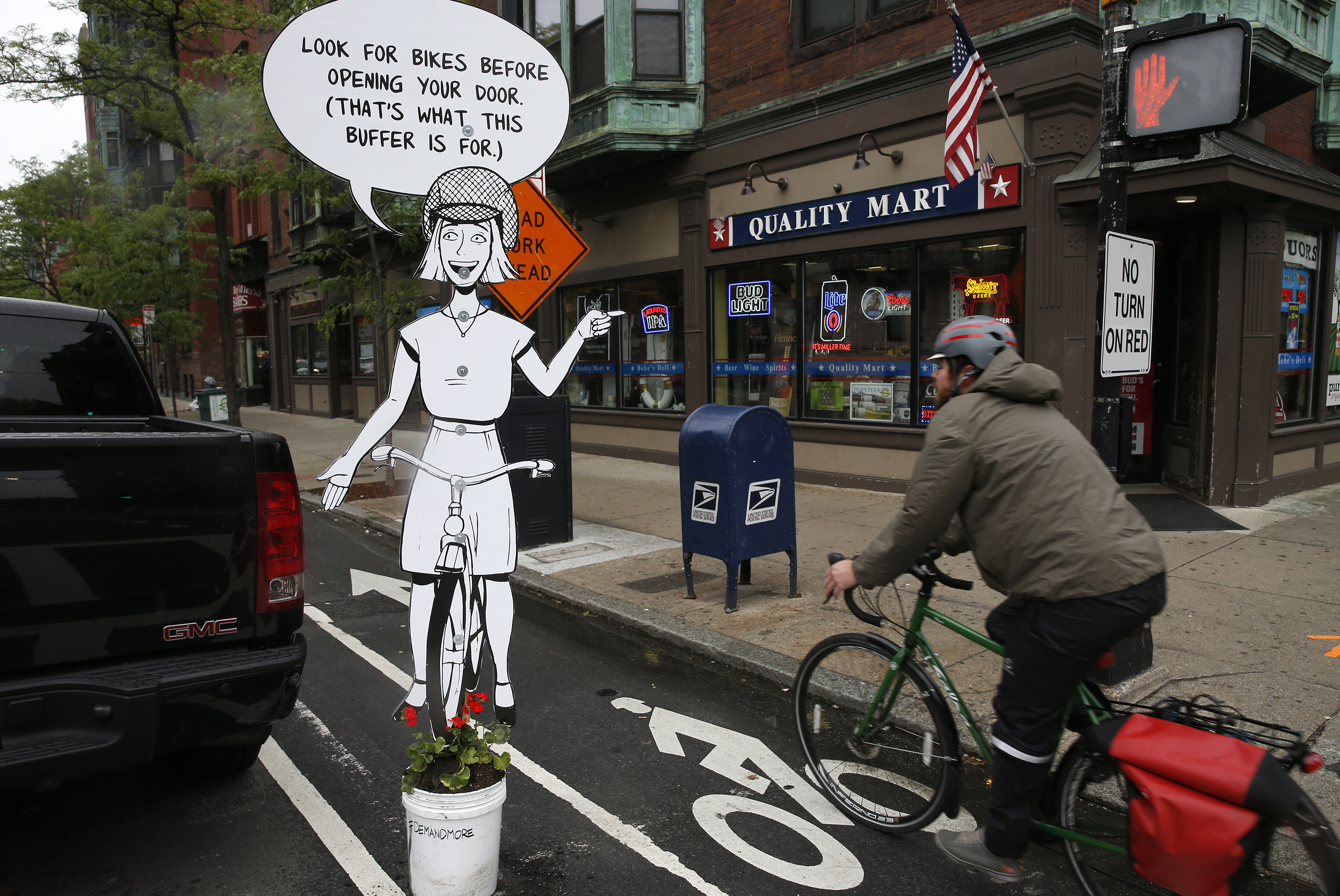 A cutout on Mass Ave. between the bike lane and the area where cars park.